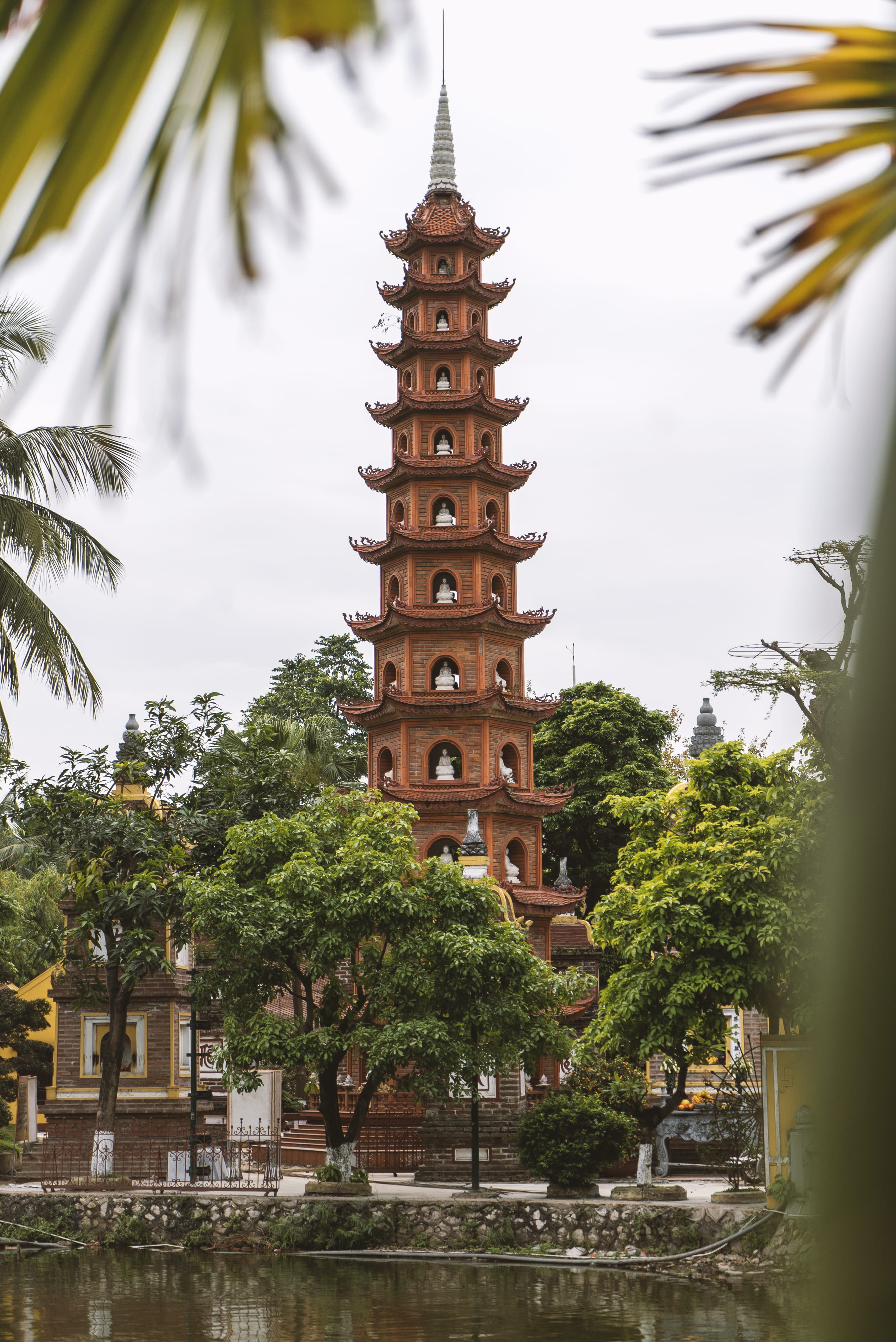 brown temple, tree, architecture, built structure, plant, building exterior