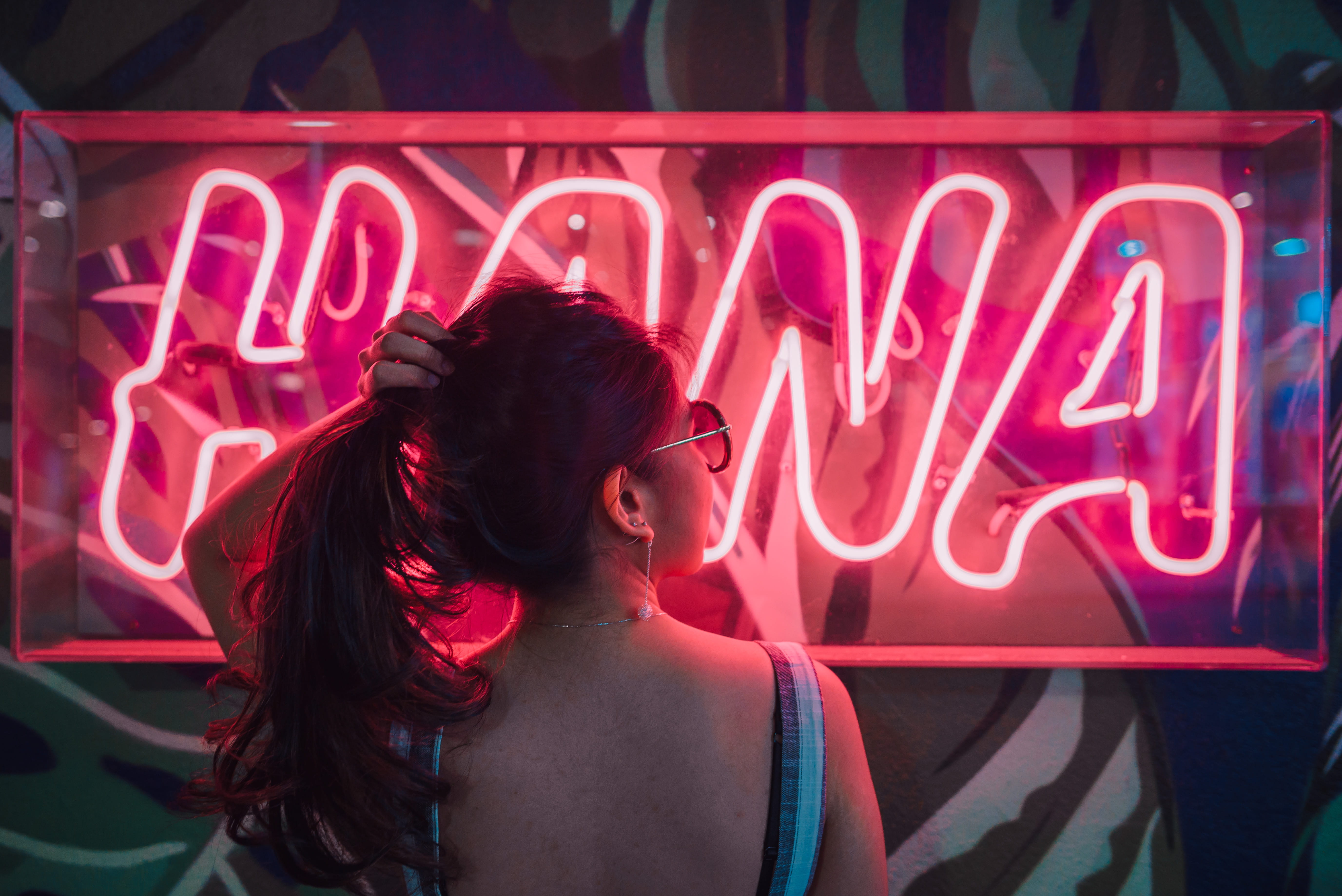 woman holding her hair, female, sign, light, glow, pink, red