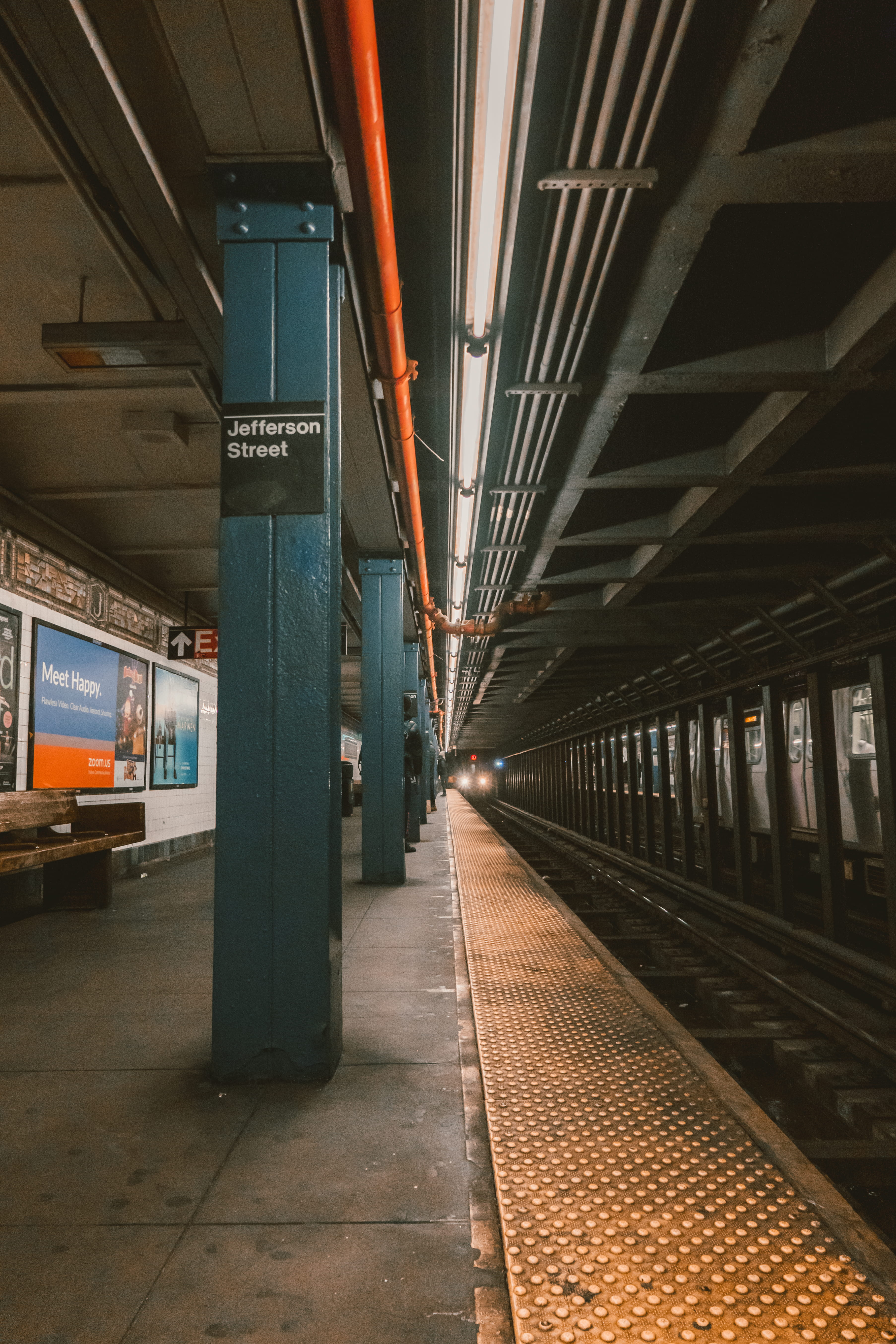 gray train station, new york city, nyc transit, yellow, leading line