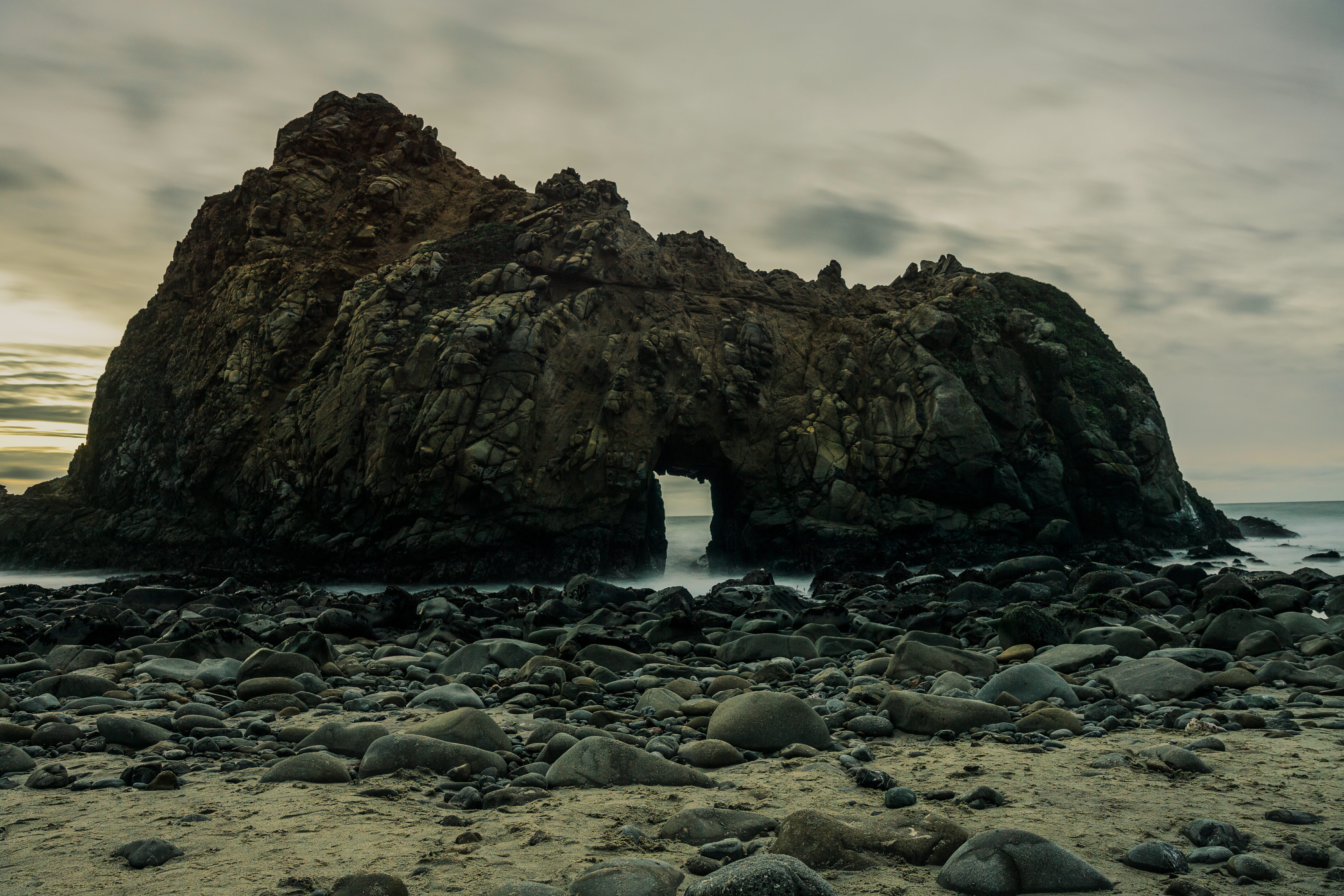 black rock formation, solid, rock - object, sky, beach, land