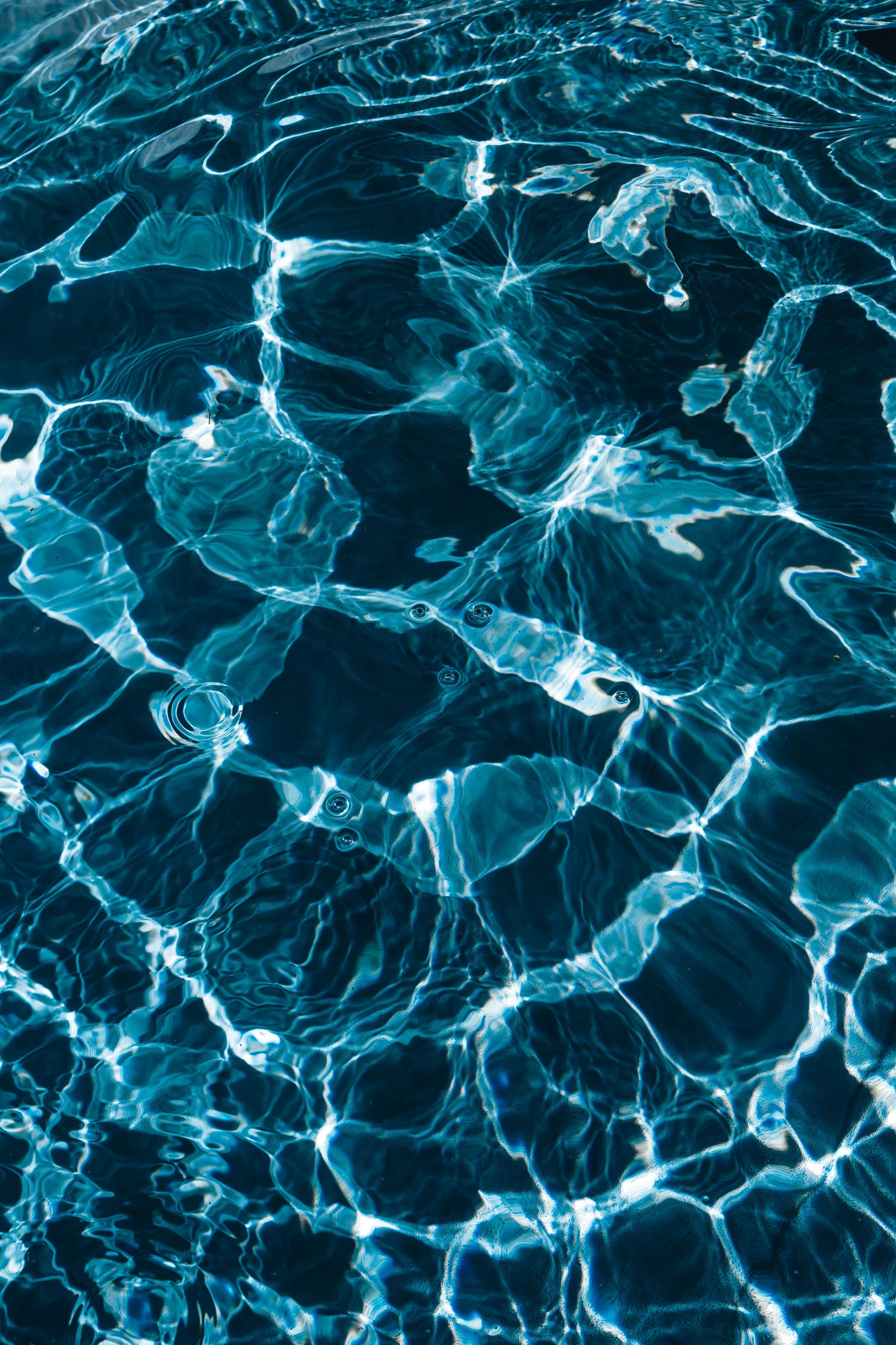 Wavy water surface in a swimming pool, wave, abstract, background