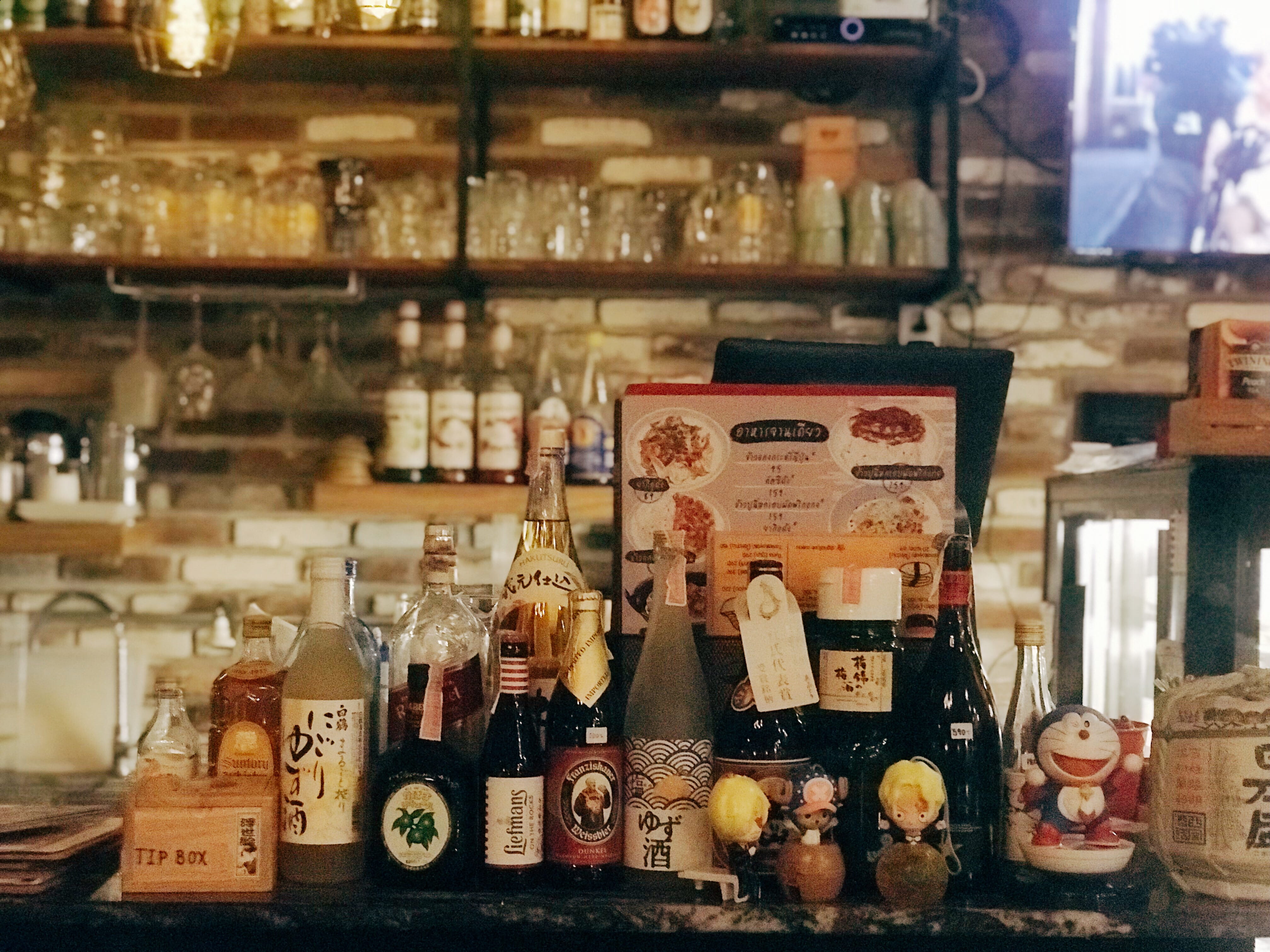 assorted-labeled bottle on bar table, variation, choice, indoors