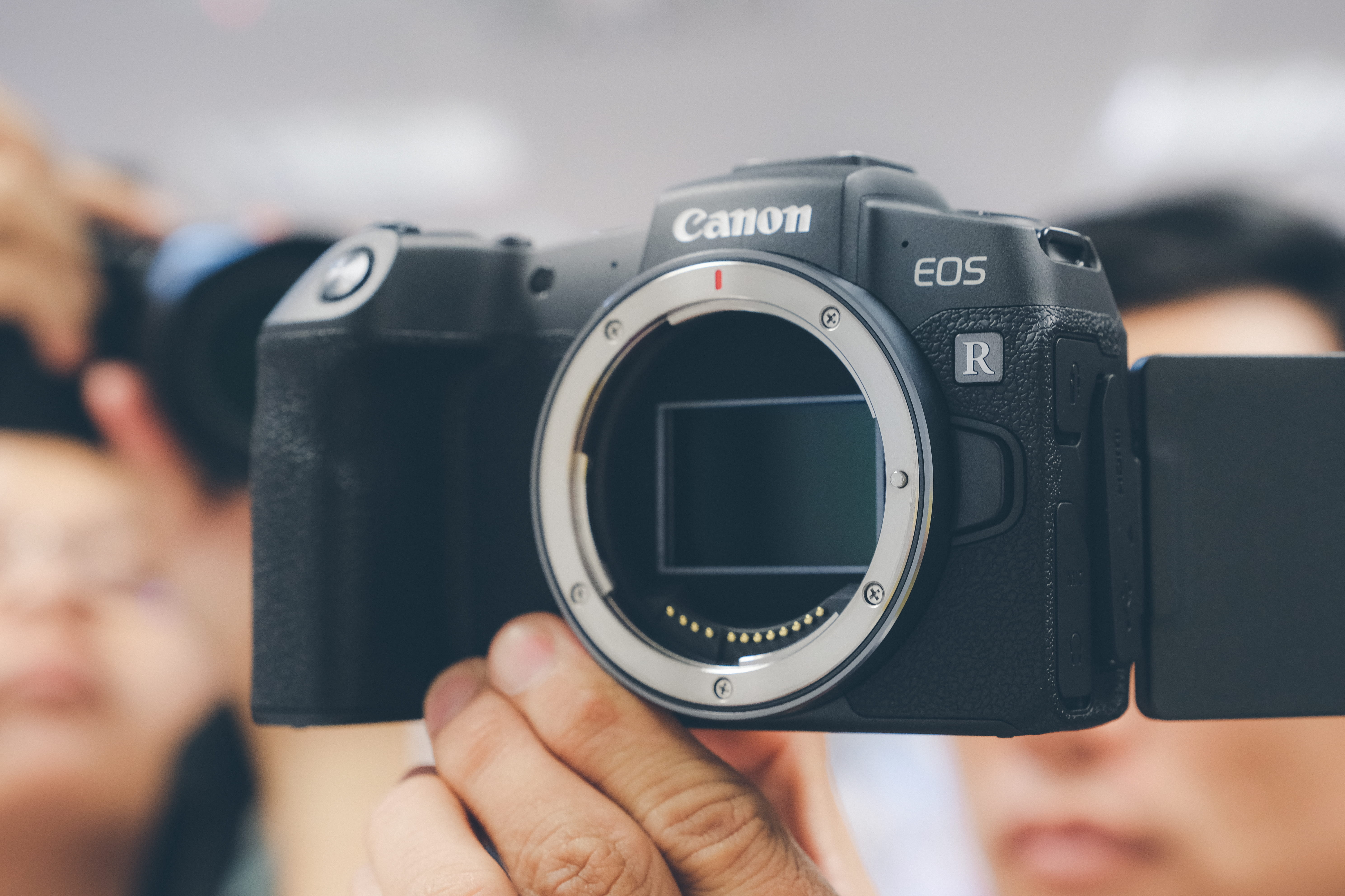 black Canon EOS R camera with no camera lens attach, electronics