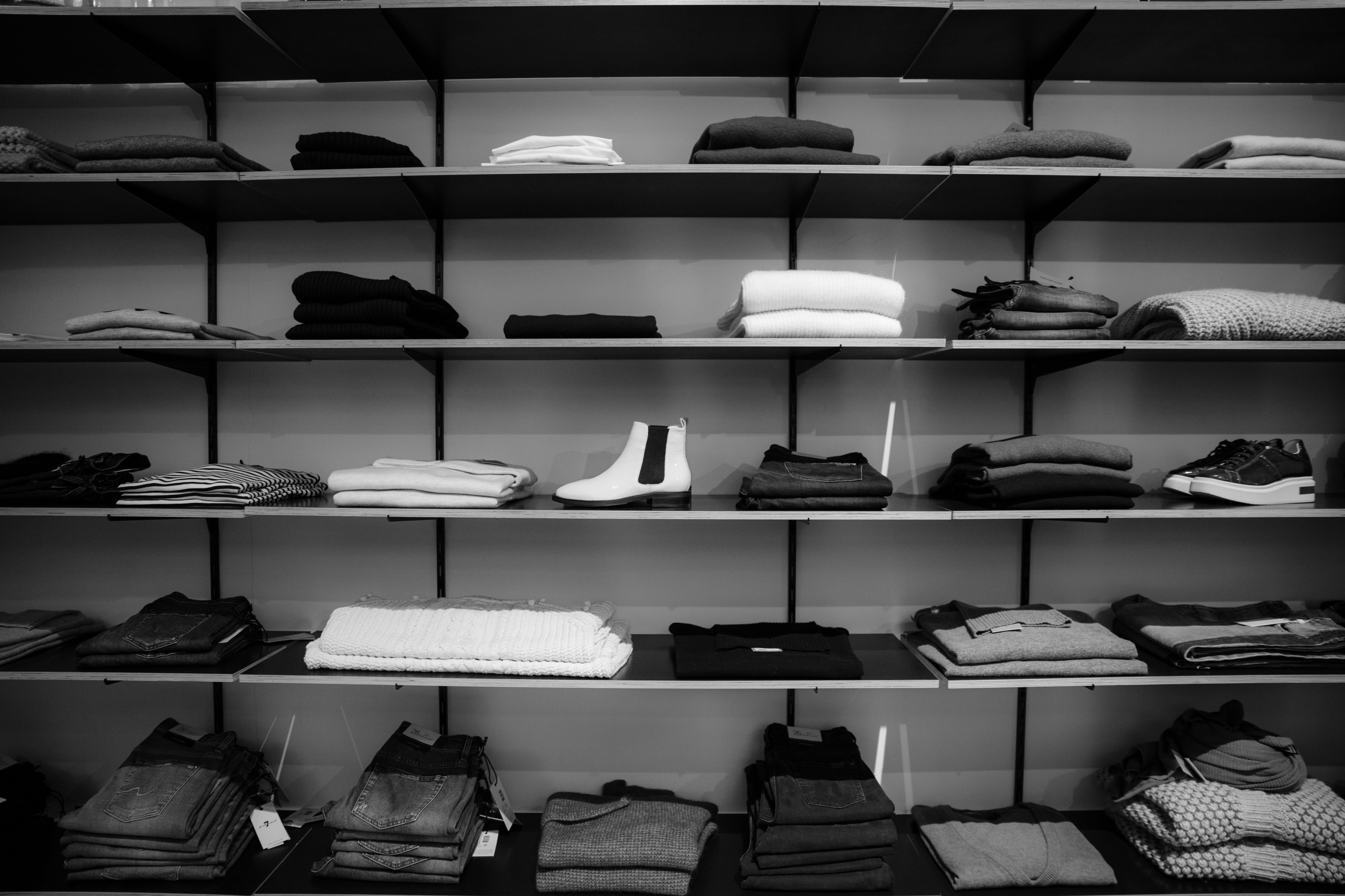 Grayscale Photography of Assorted Apparels on Shelf Rack, black-and-white