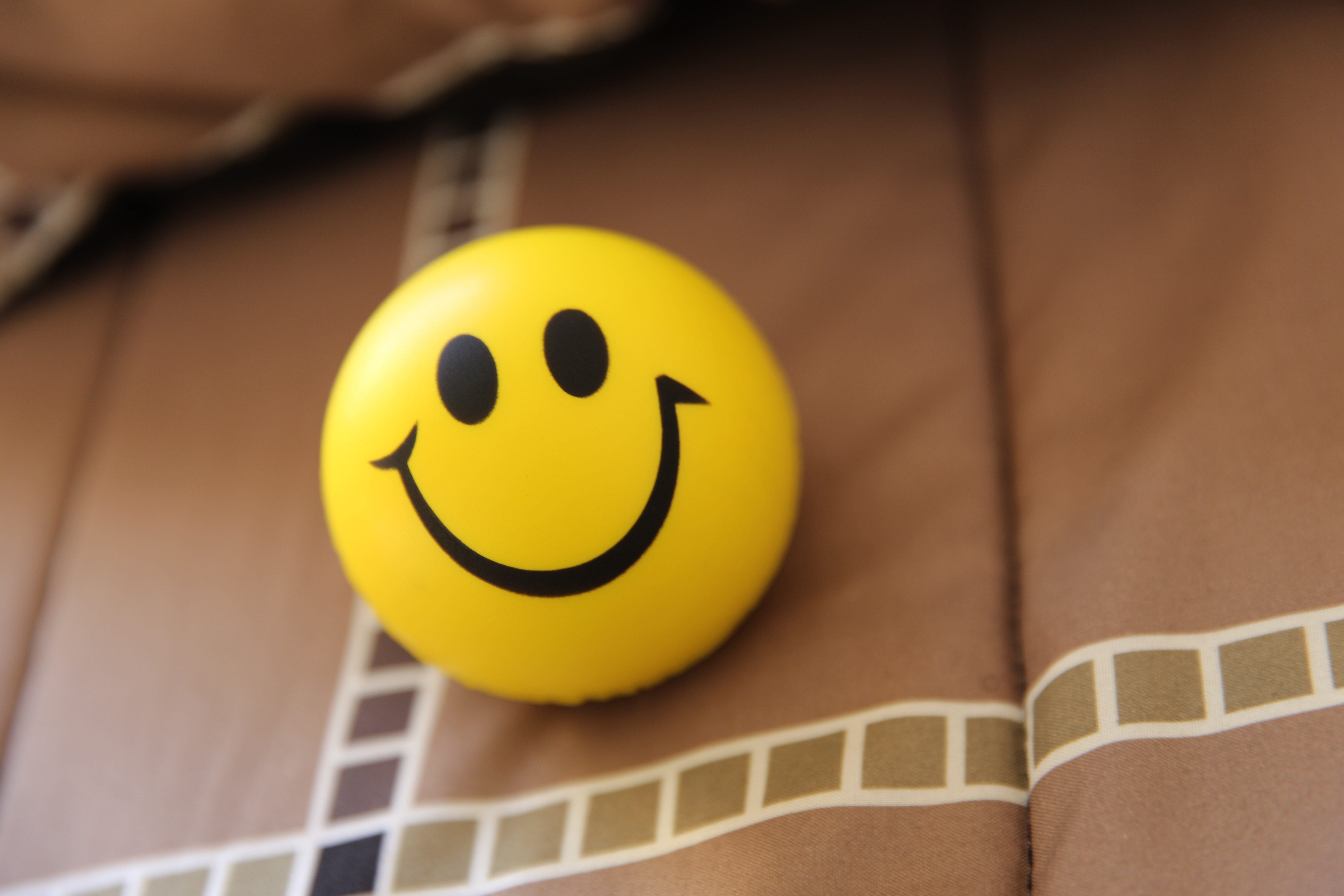 anthropomorphic smiley face, smiling, yellow, close-up, representation