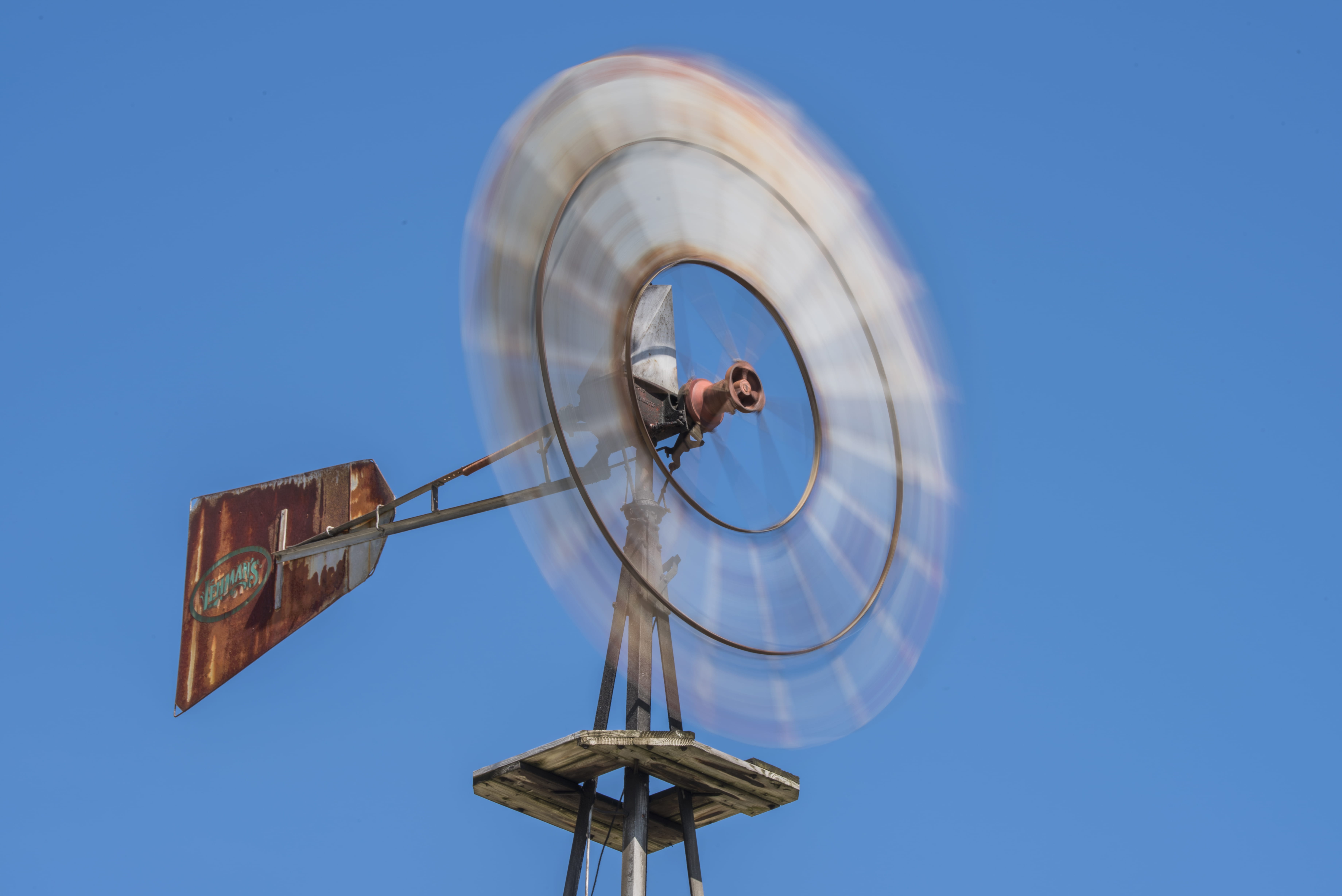 brown wind mill under blue sky, low angle view, nature, clear sky