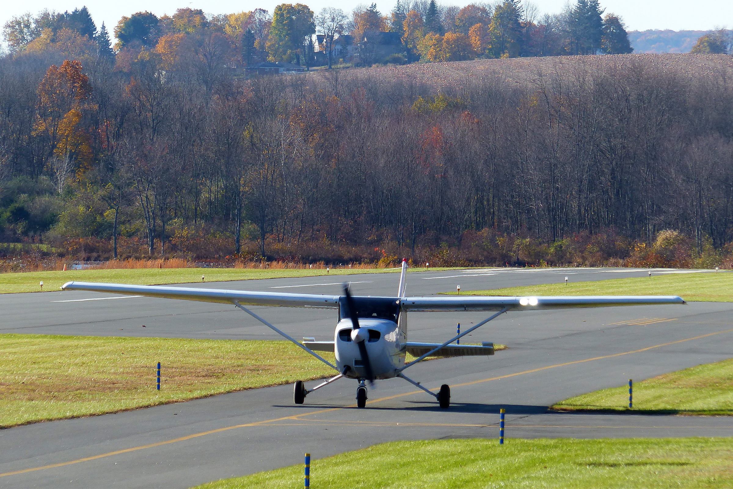 A Cessna single engine private airplane on the tarmac waiting for takeoff.