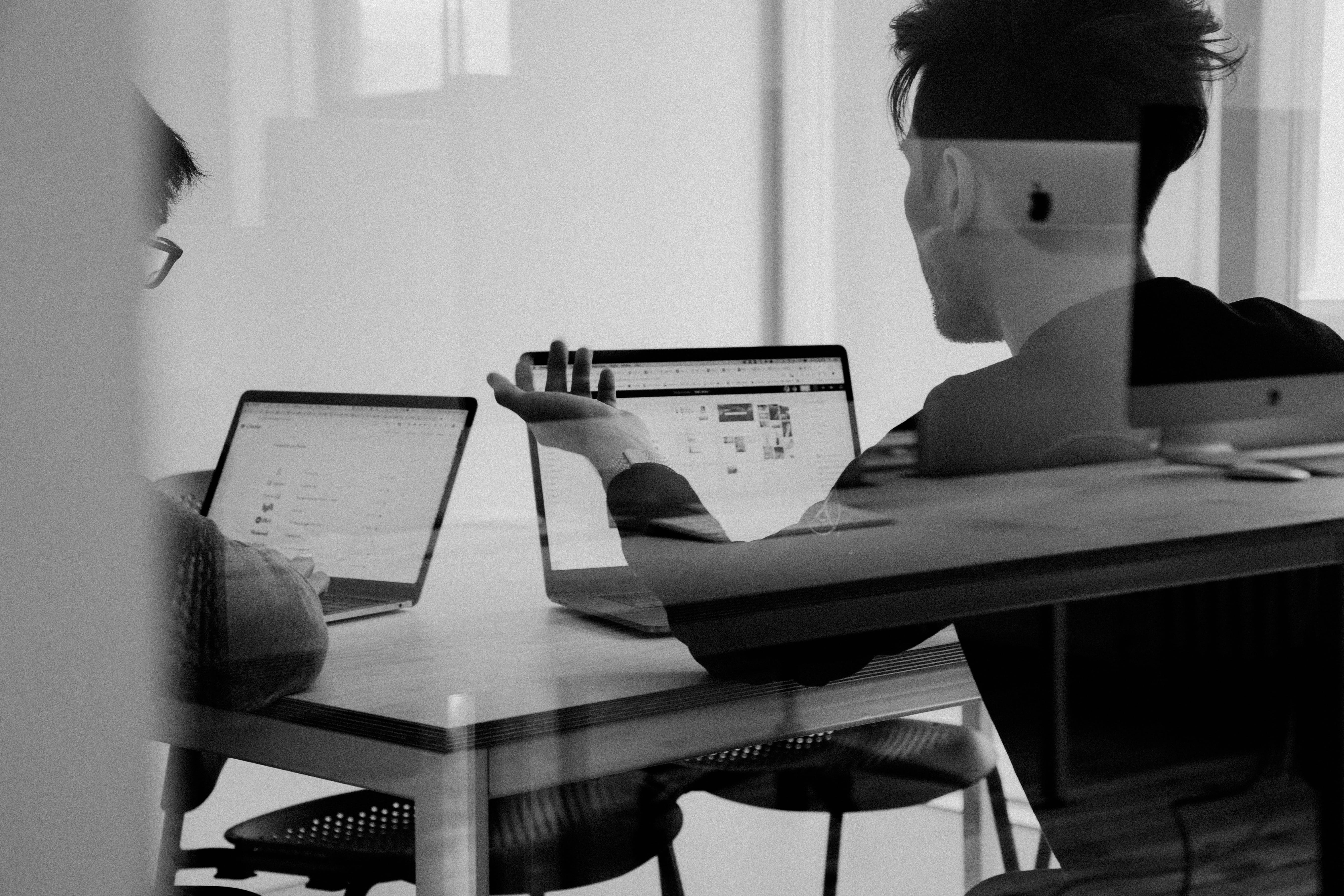 man using MacBook, indoors, table, education, one person, learning