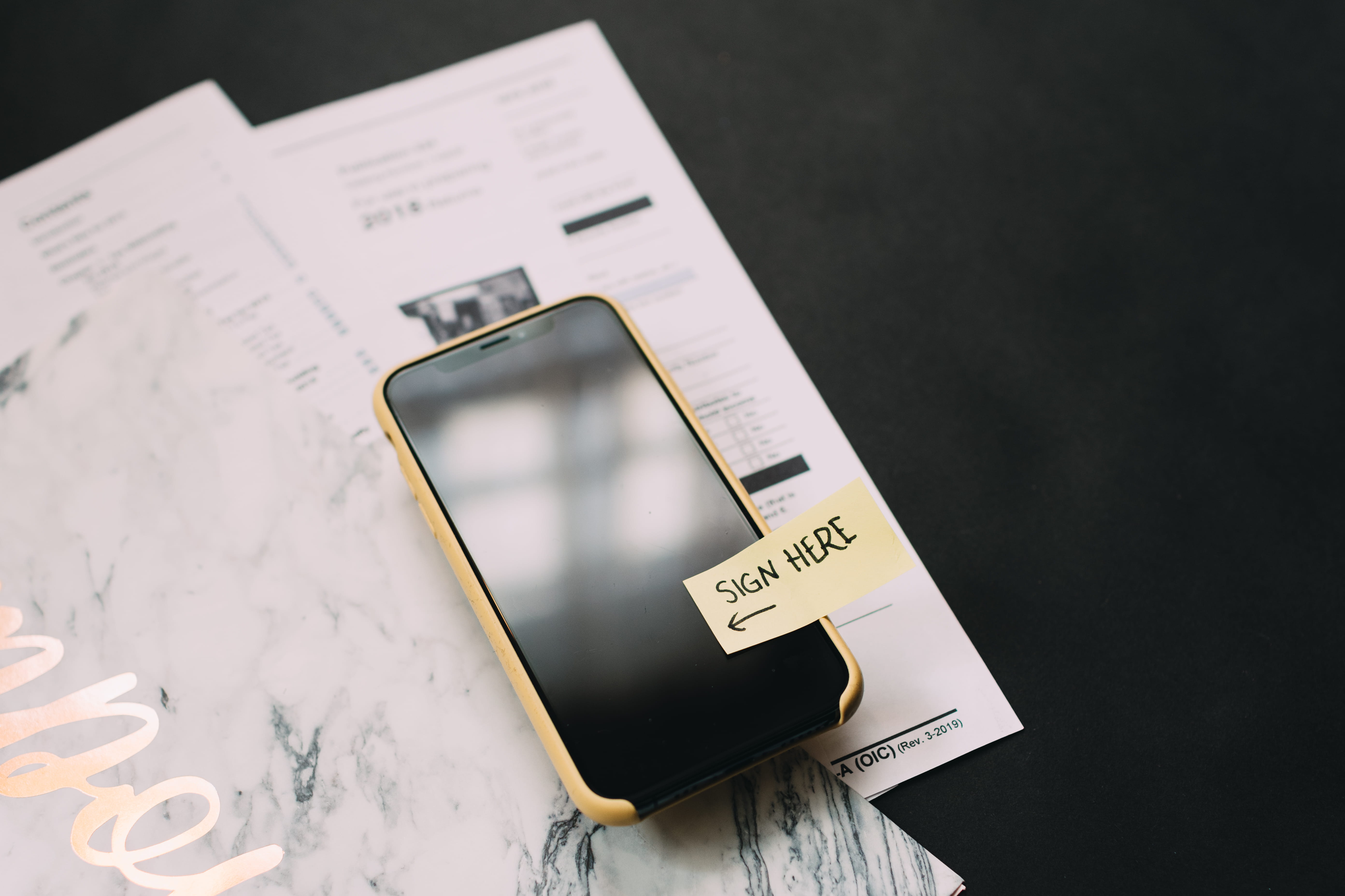 black smartphone, text, communication, western script, still life