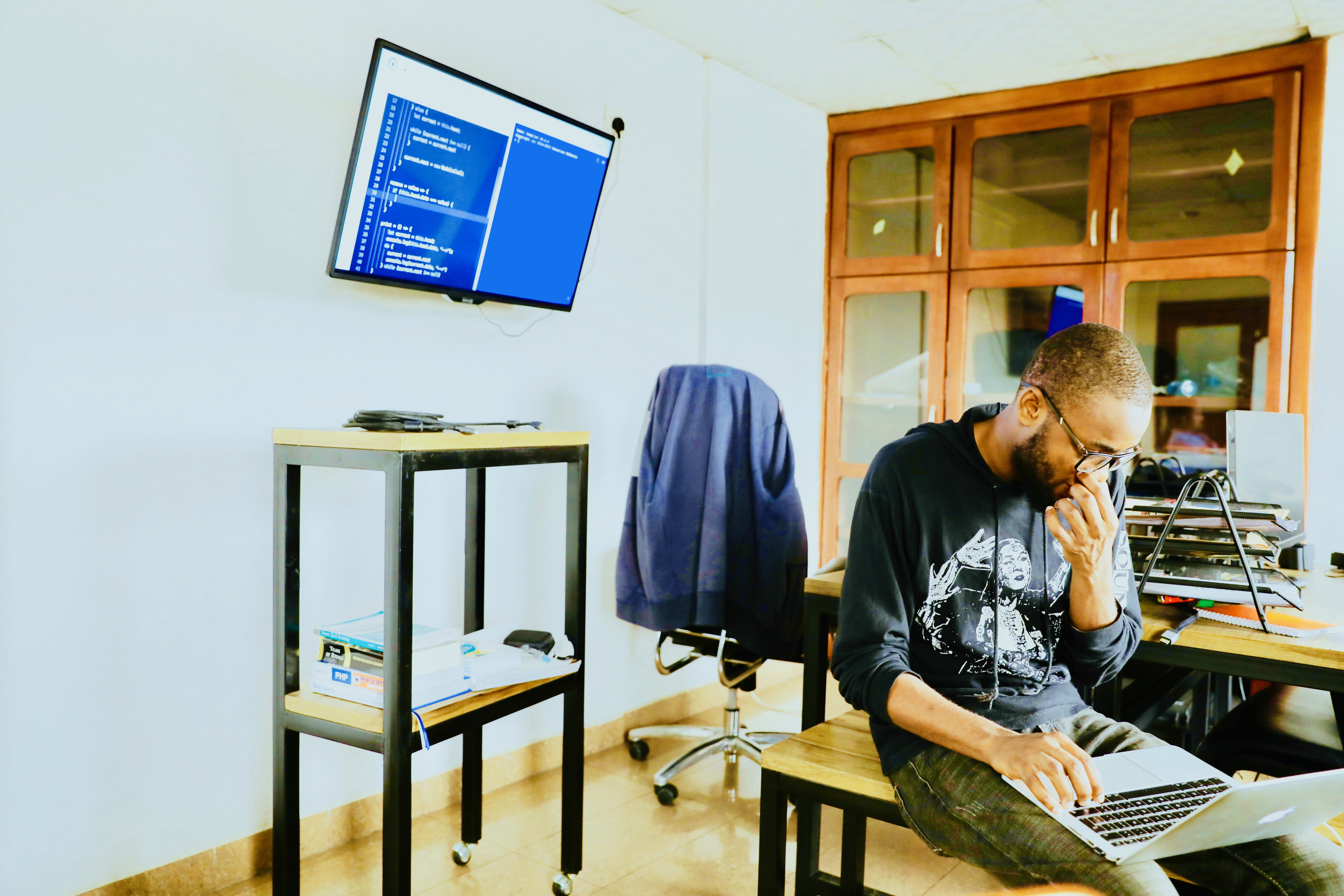 man using silver MacBook while sitting, table, real people, computer