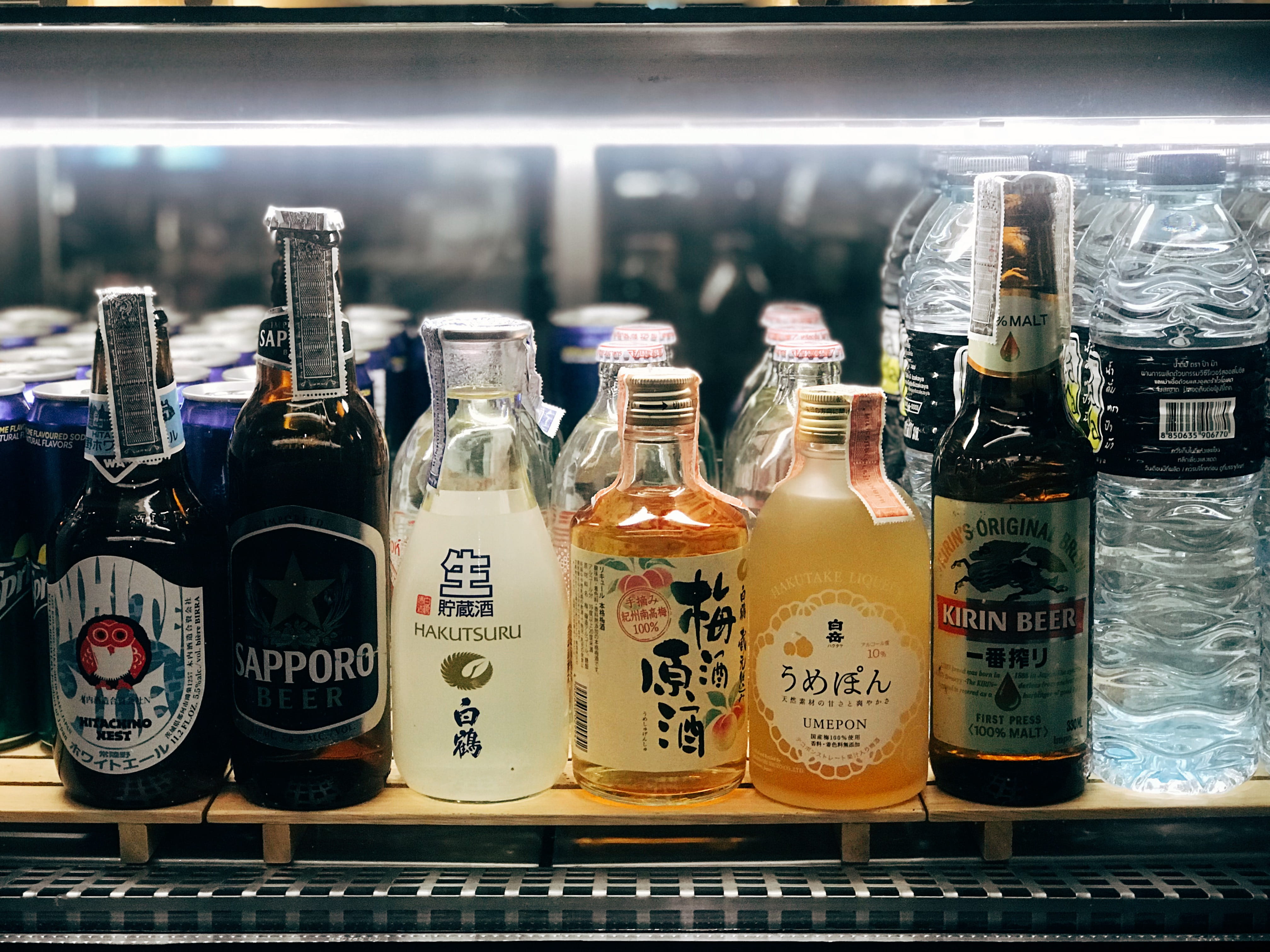 six assorted-brand bottle s, container, glass - material, text