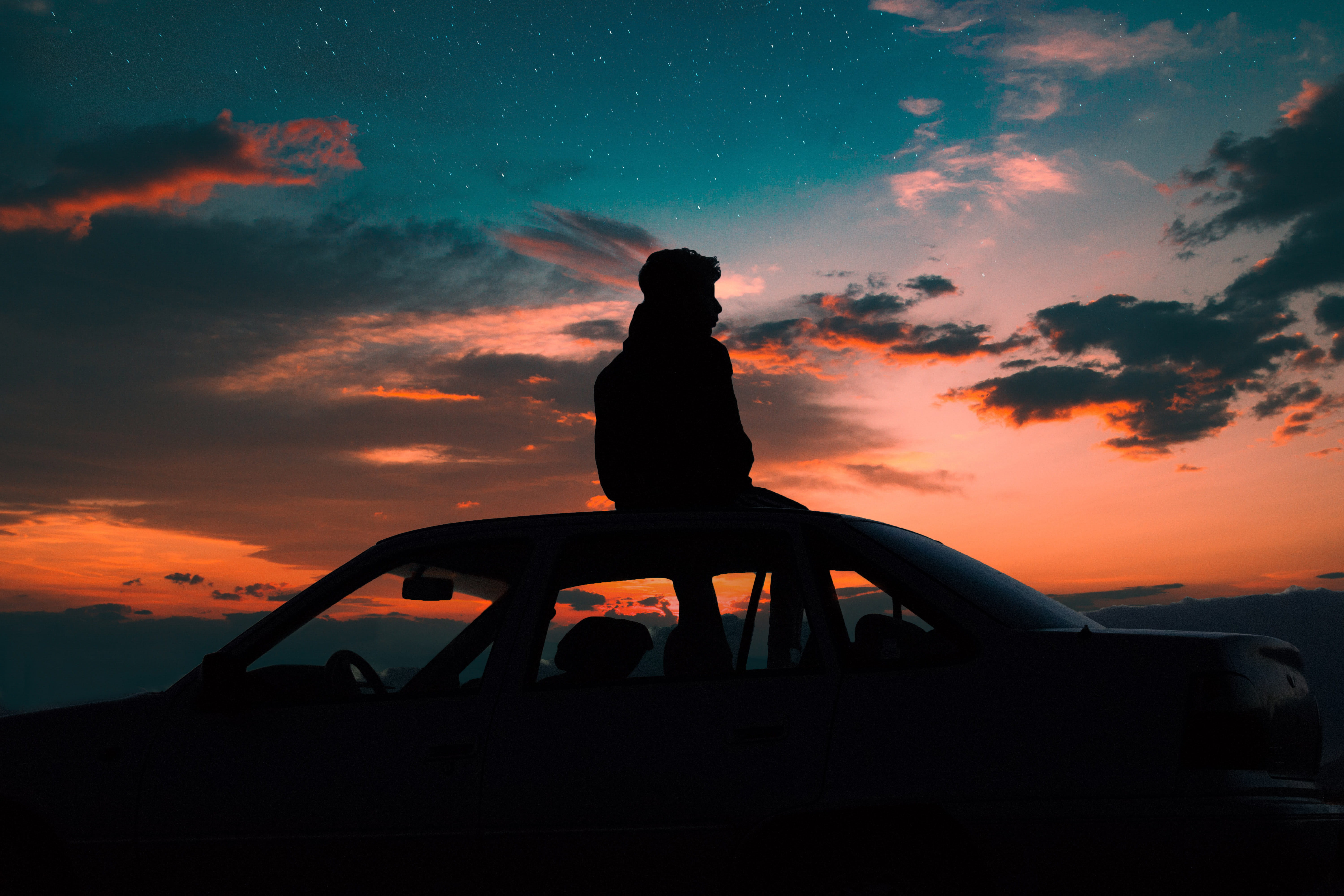 silhouette of man sitting on car roof, person, cloud, sunset