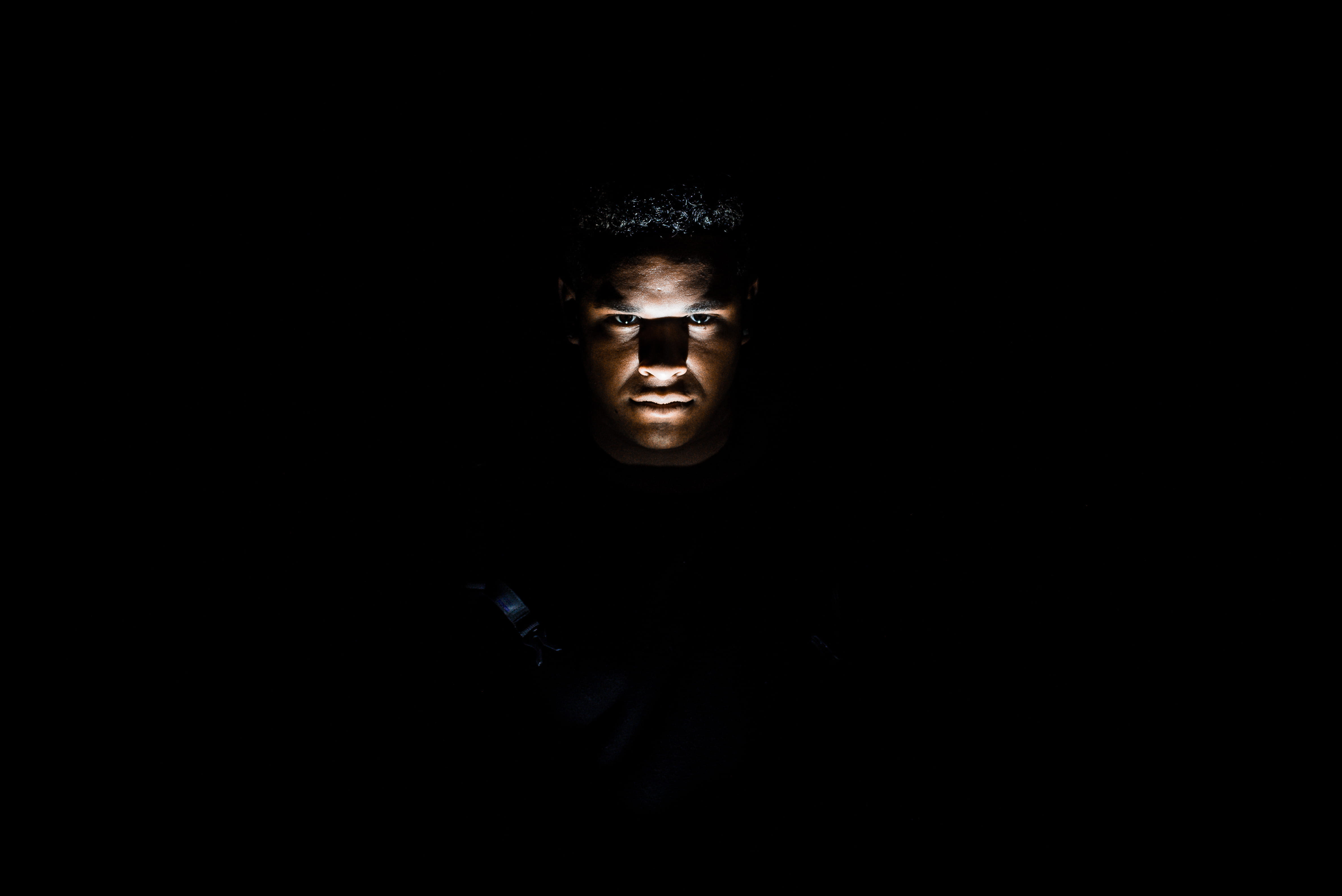 man's face, portrait, one person, looking at camera, studio shot