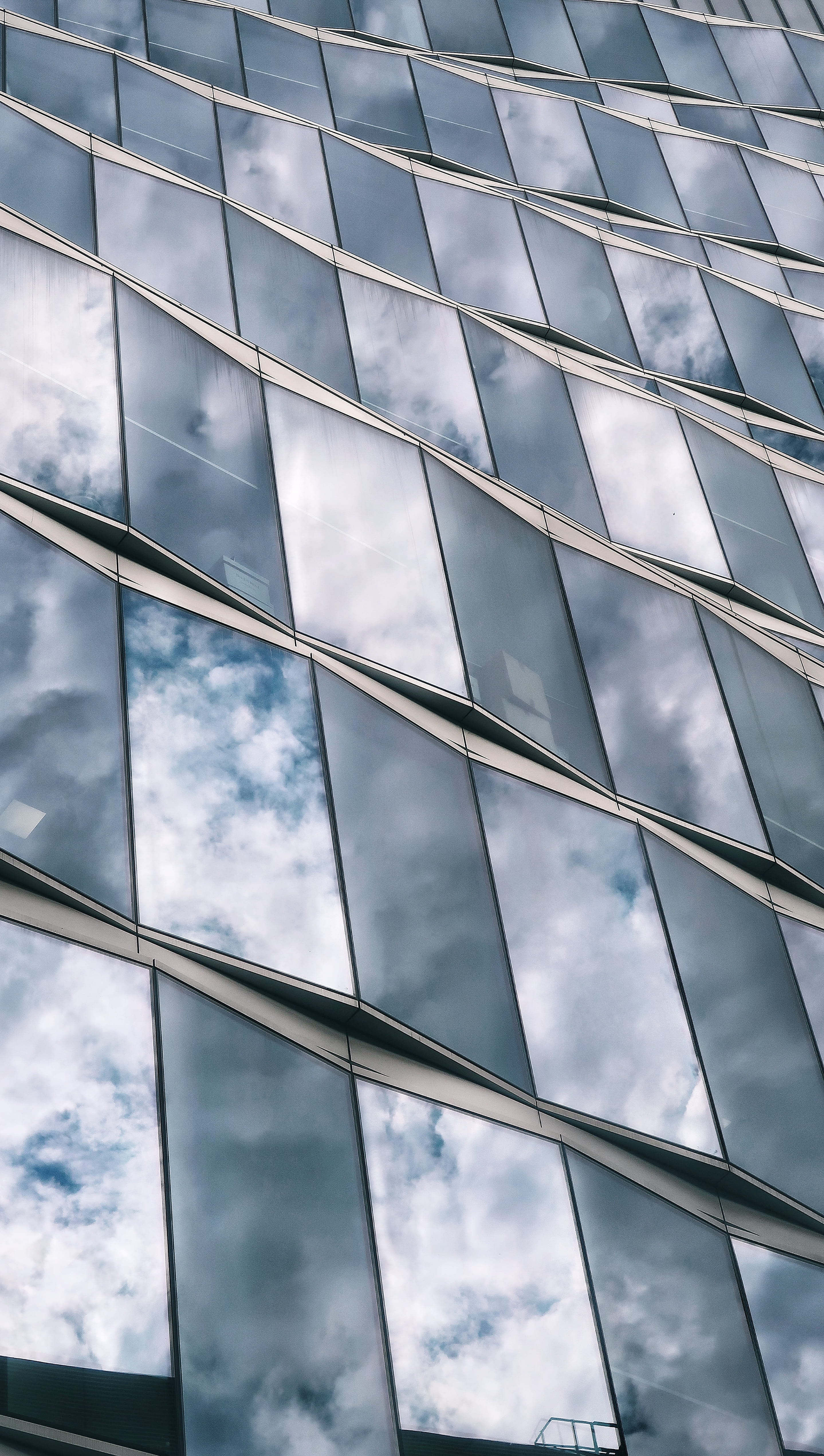 gray surface, low angle view, cloud - sky, built structure, architecture