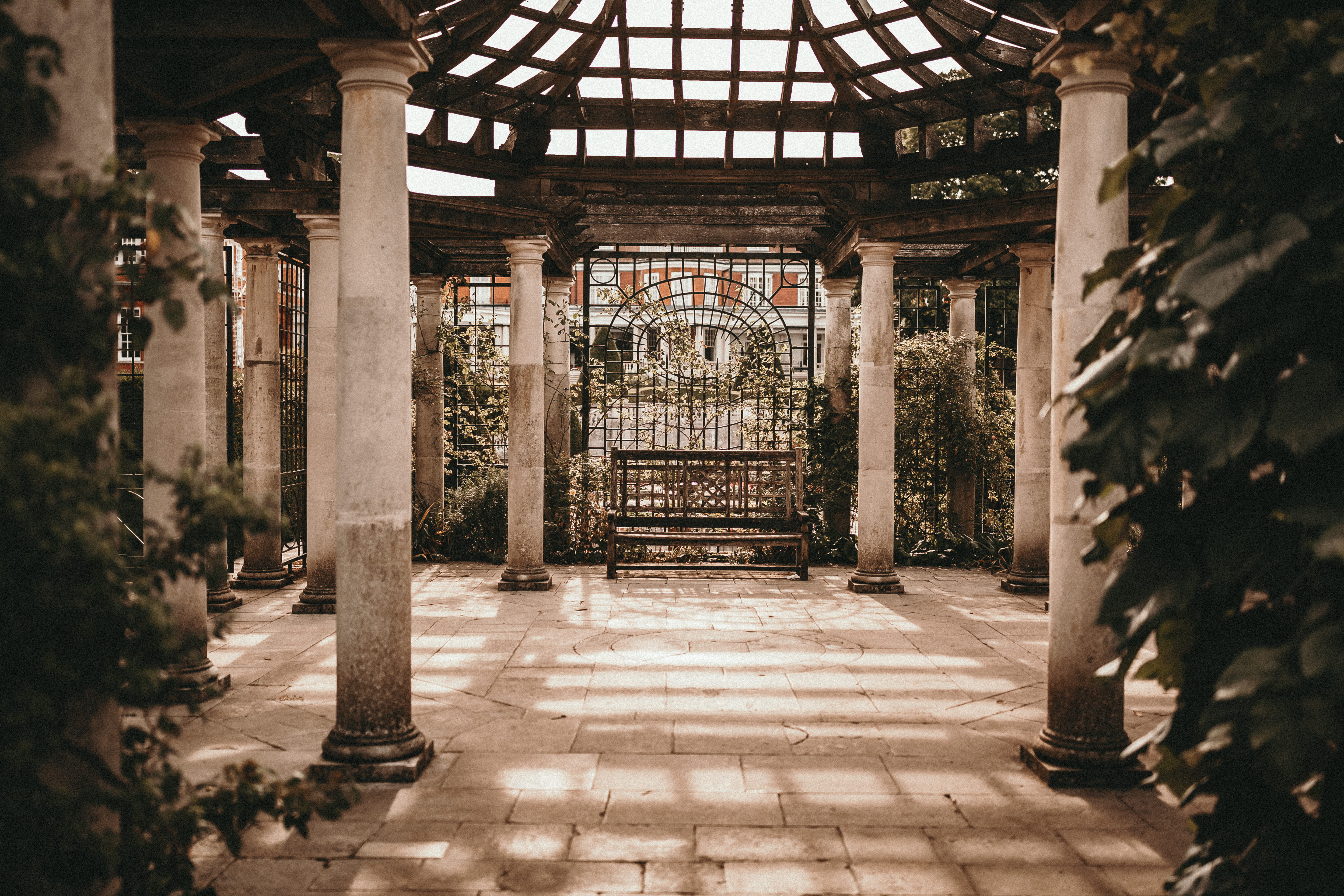 empty wooden bench between stone pillars, architecture, built structure