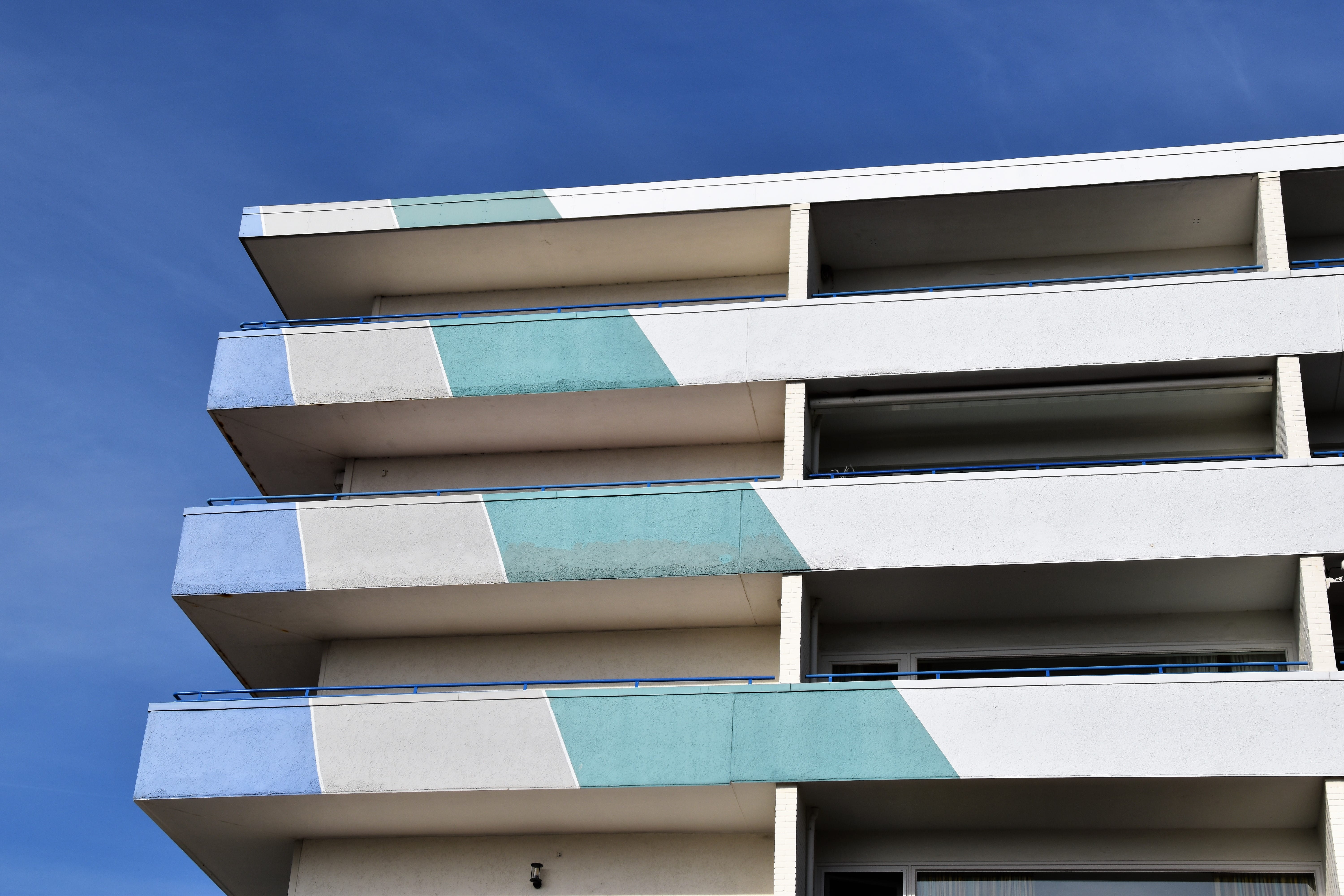 white concrete building, architecture, building exterior, blue