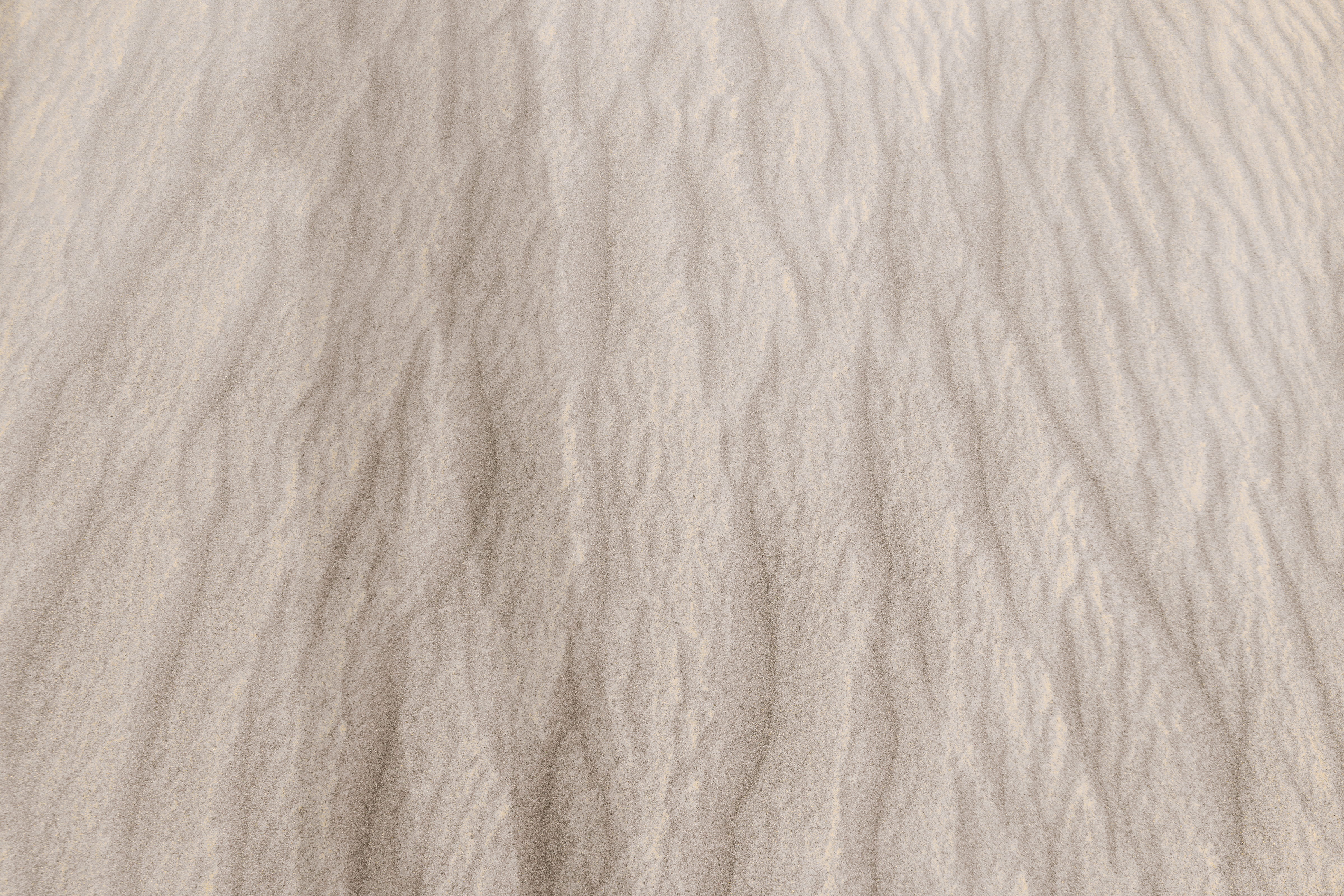Sand texture. Sandy beach for background. Top view, backgrounds