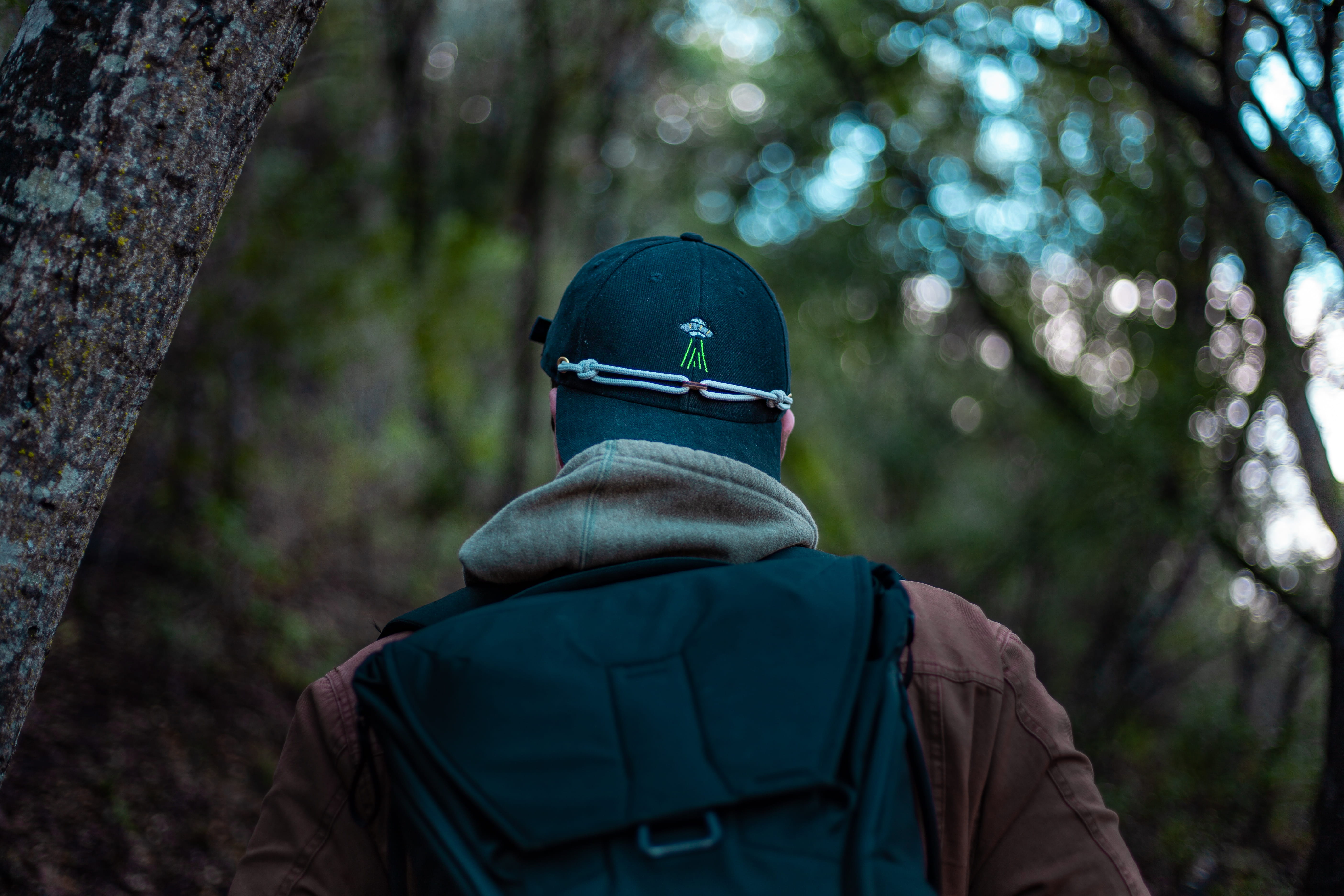 Man Standing Under Tree, backpack, backpacker, blurred background