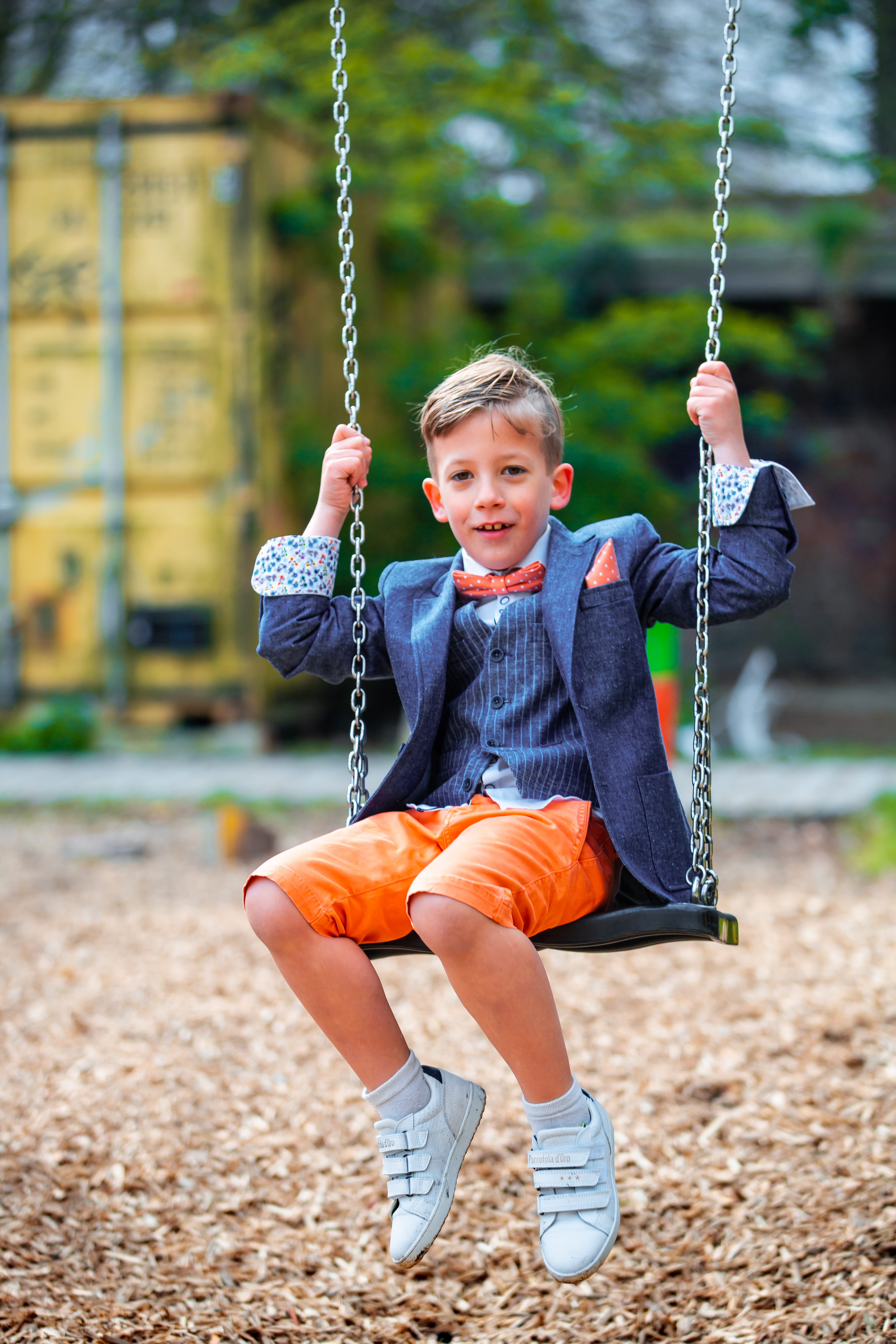 boy in pinstriped suit jacket on swing, apparel, shoe, footwear