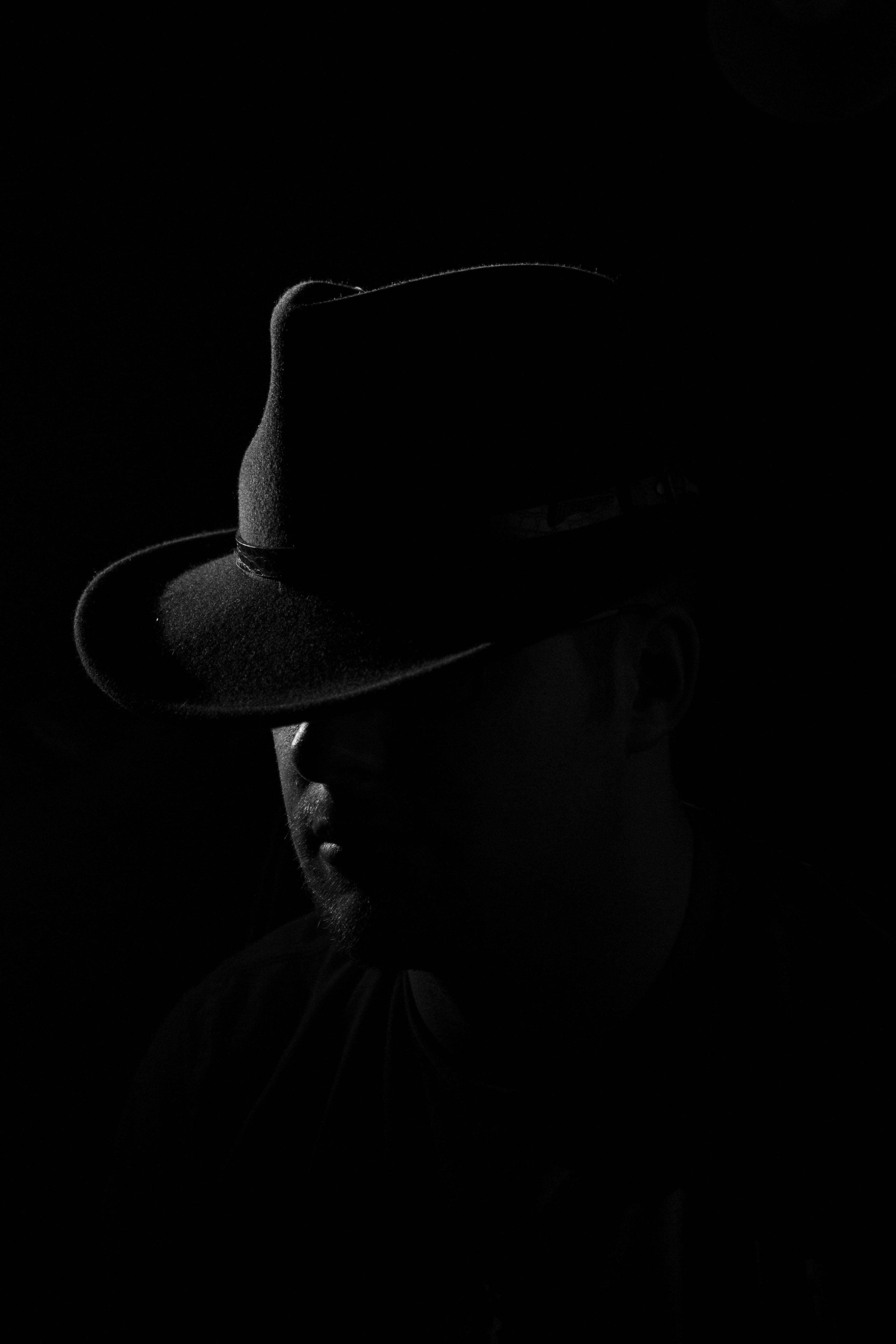 man wearing black hat, apparel, clothing, person, human, sun hat