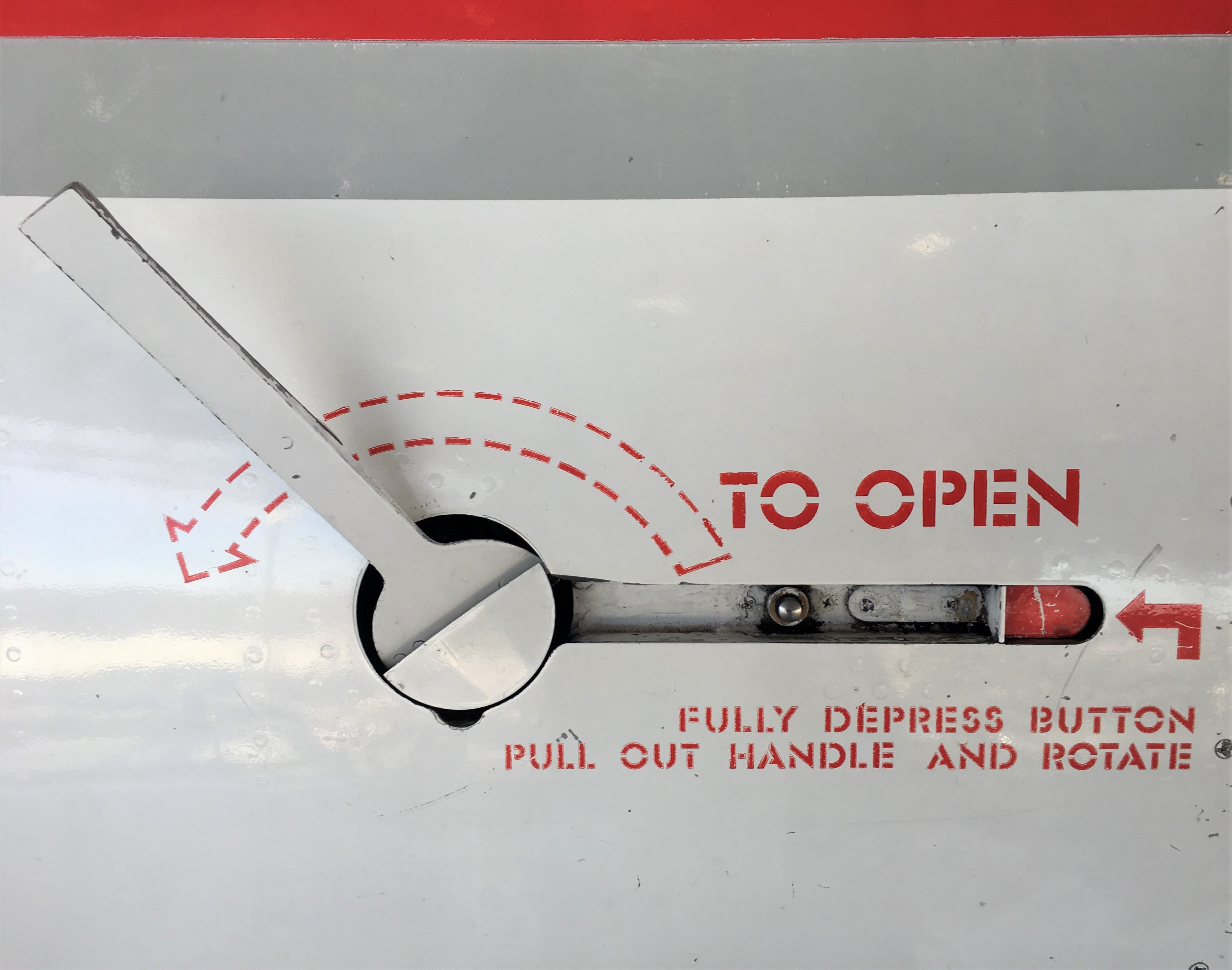red and white cutting platform, text, western script, no people