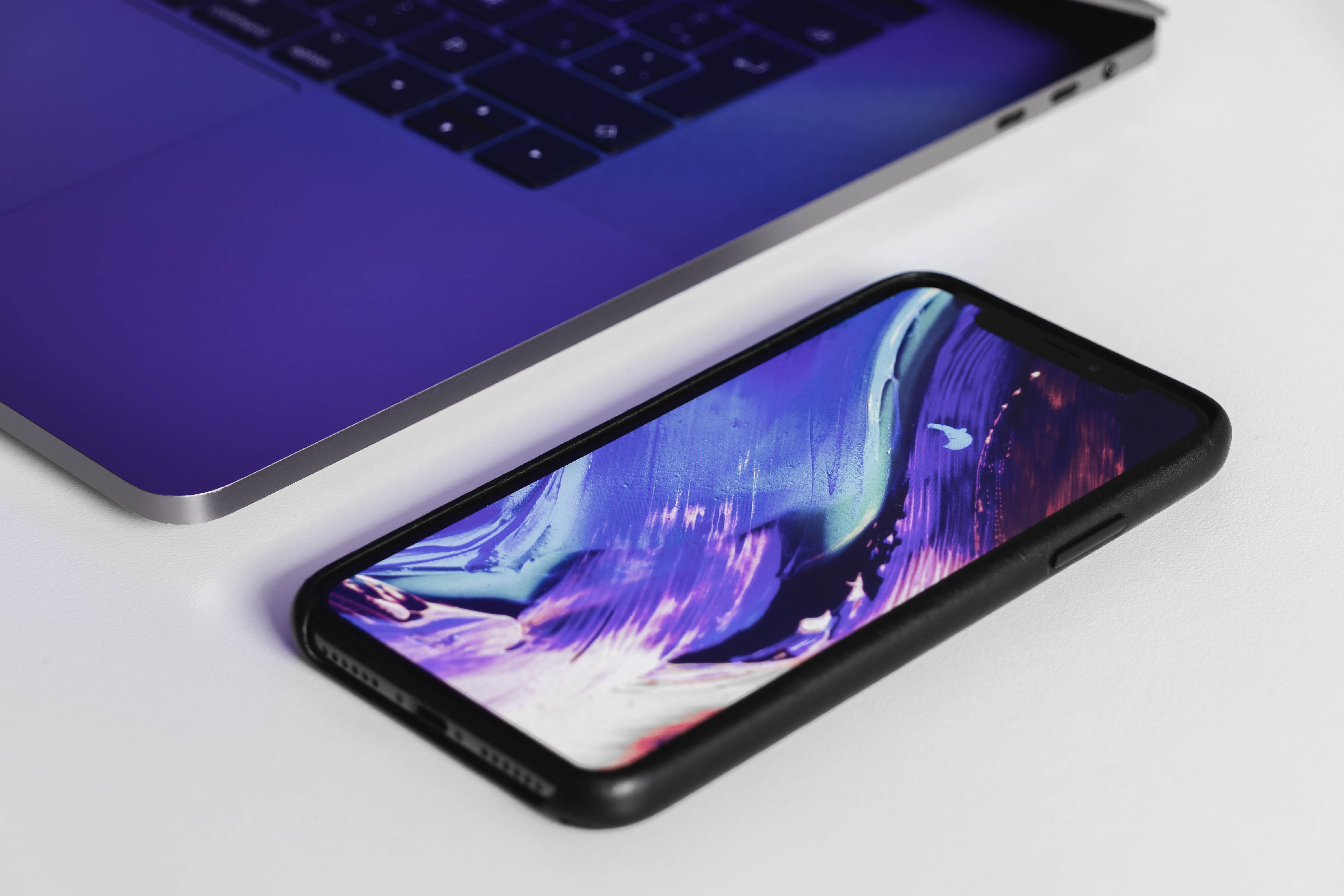 black Android smartphone beside laptop computer, technology, wireless technology