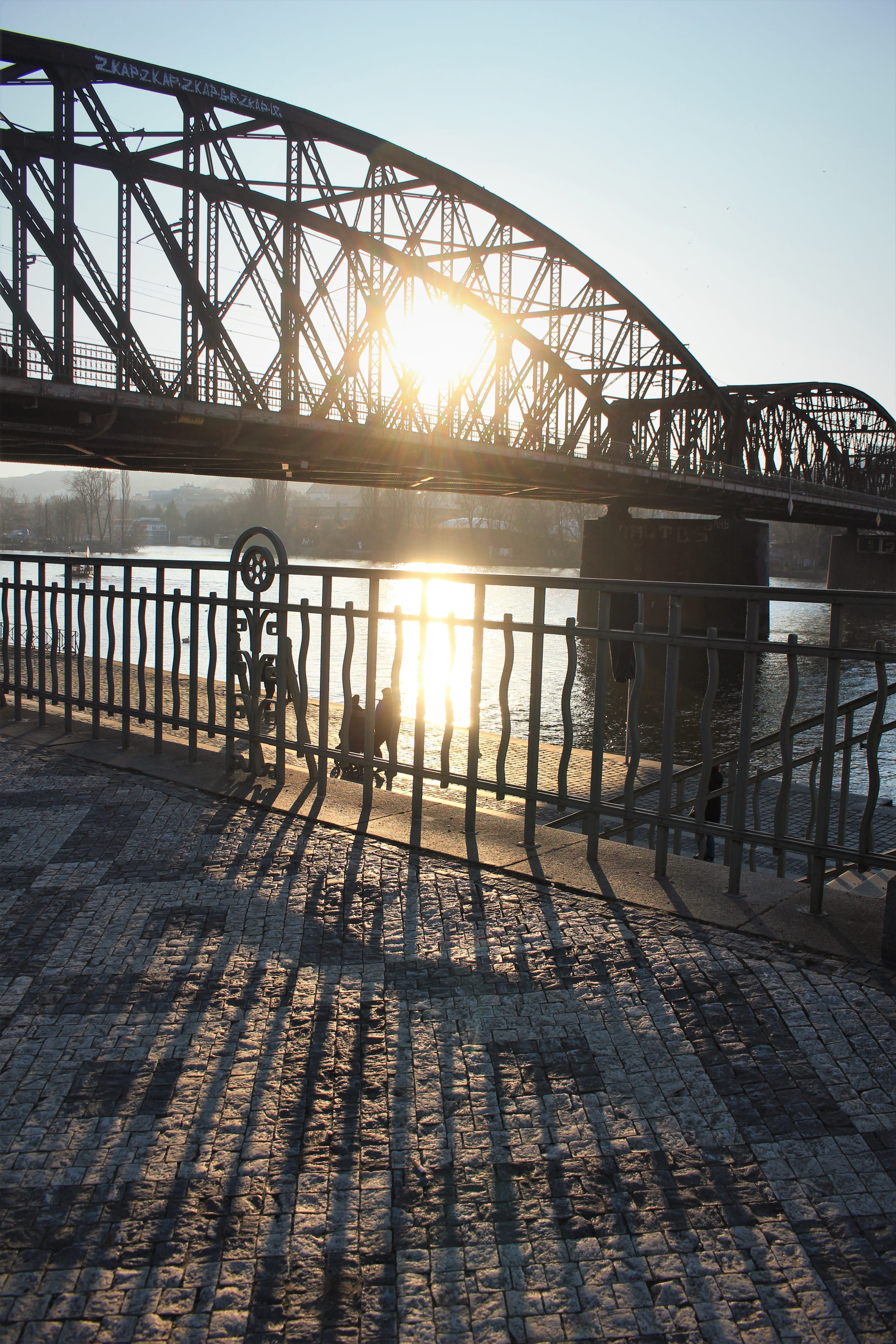 light, flare, sunlight, path, walkway, railing, outdoors, sidewalk