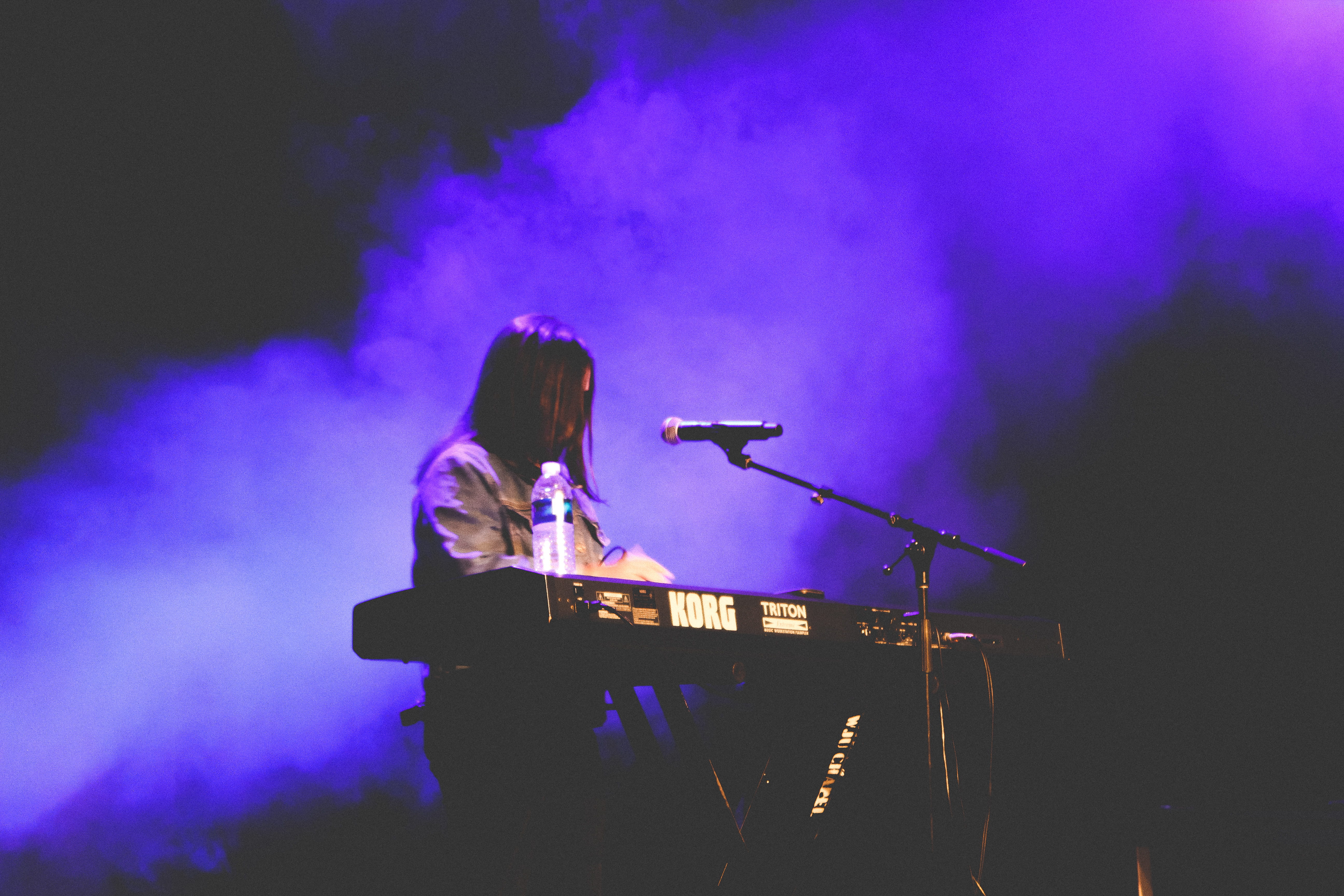 woman playing electronic keyboard, person, human, musician, lighting