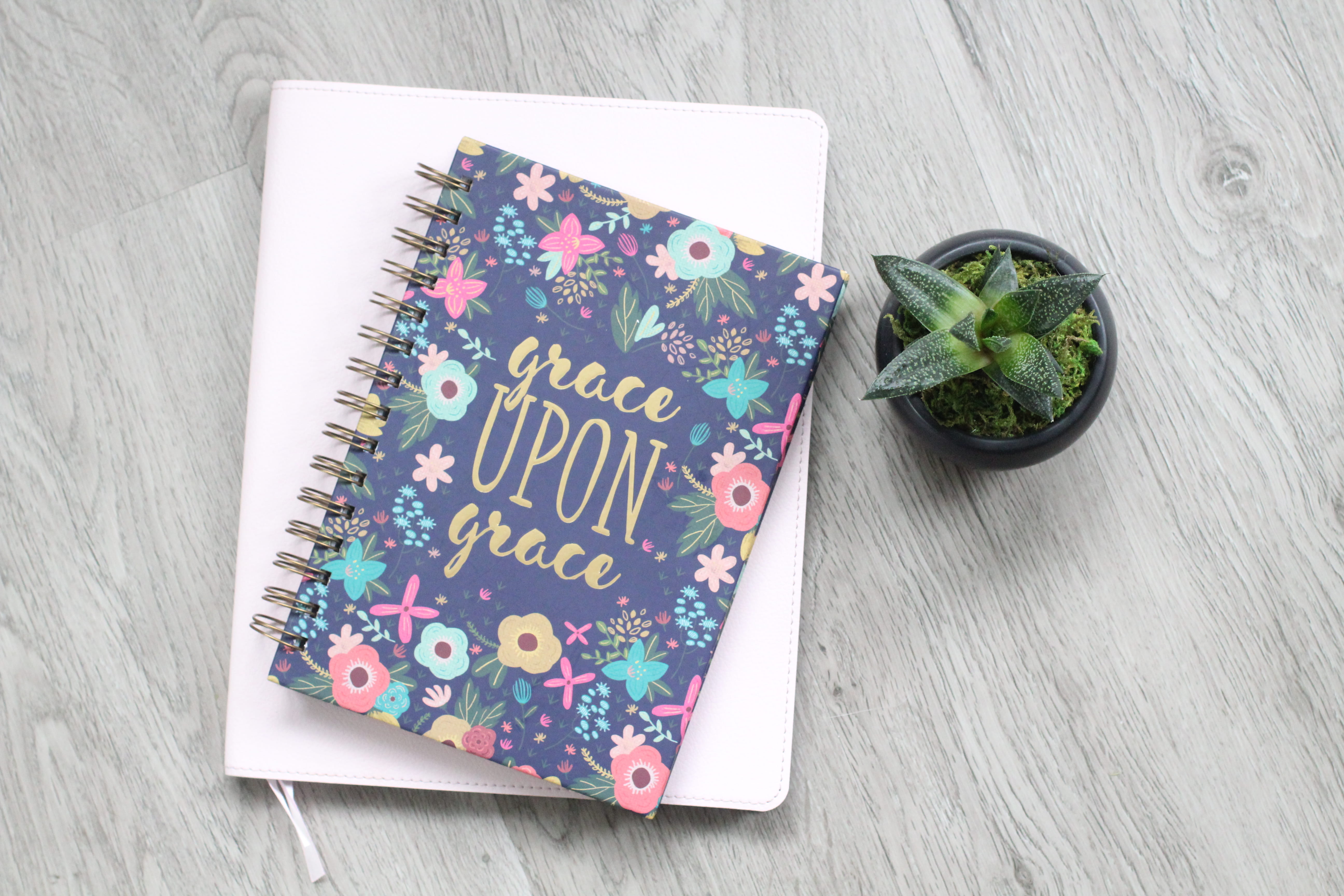 Grace Upon Grace book on white surface, text, high angle view