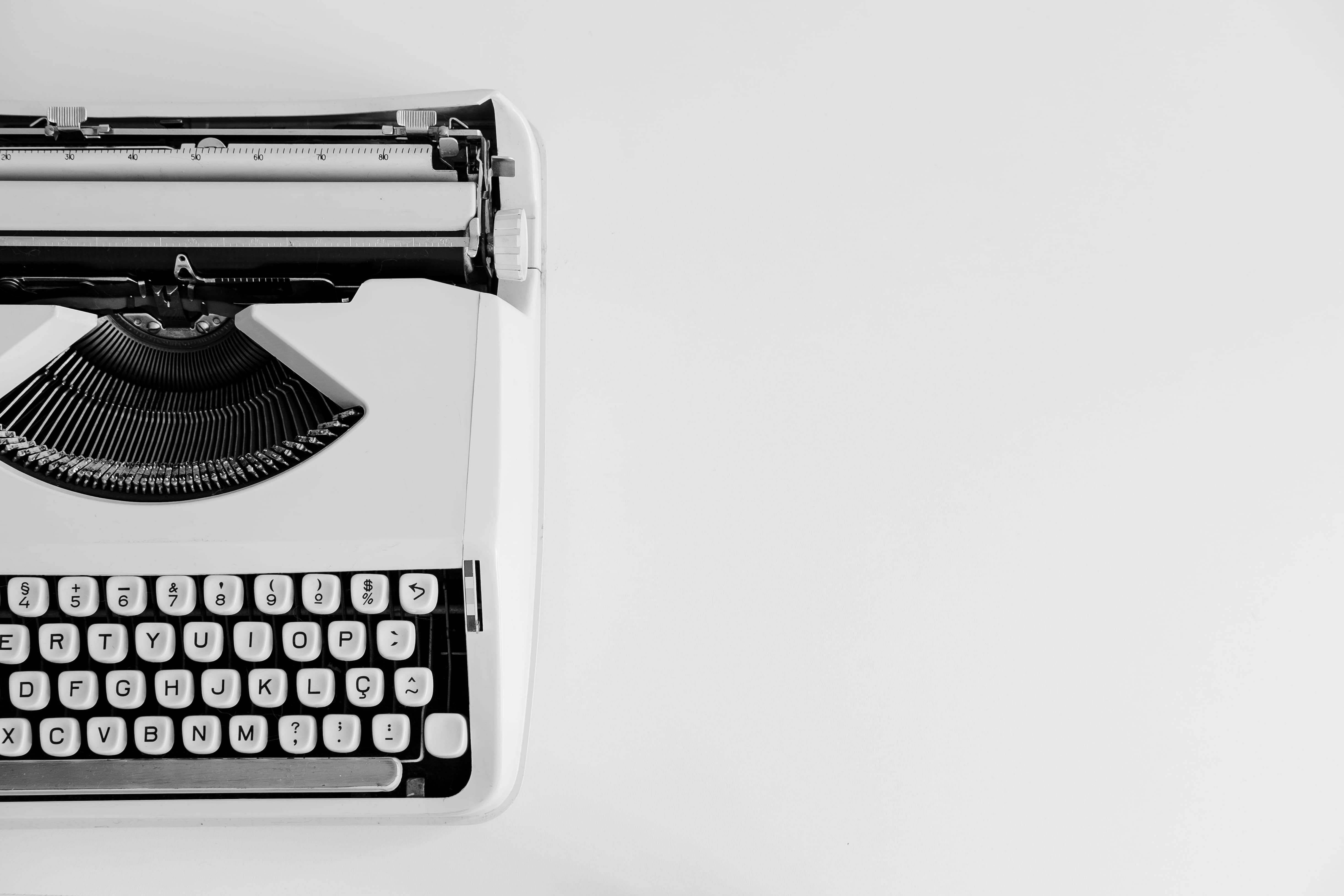 white and black typewriter, copy space, retro styled, technology