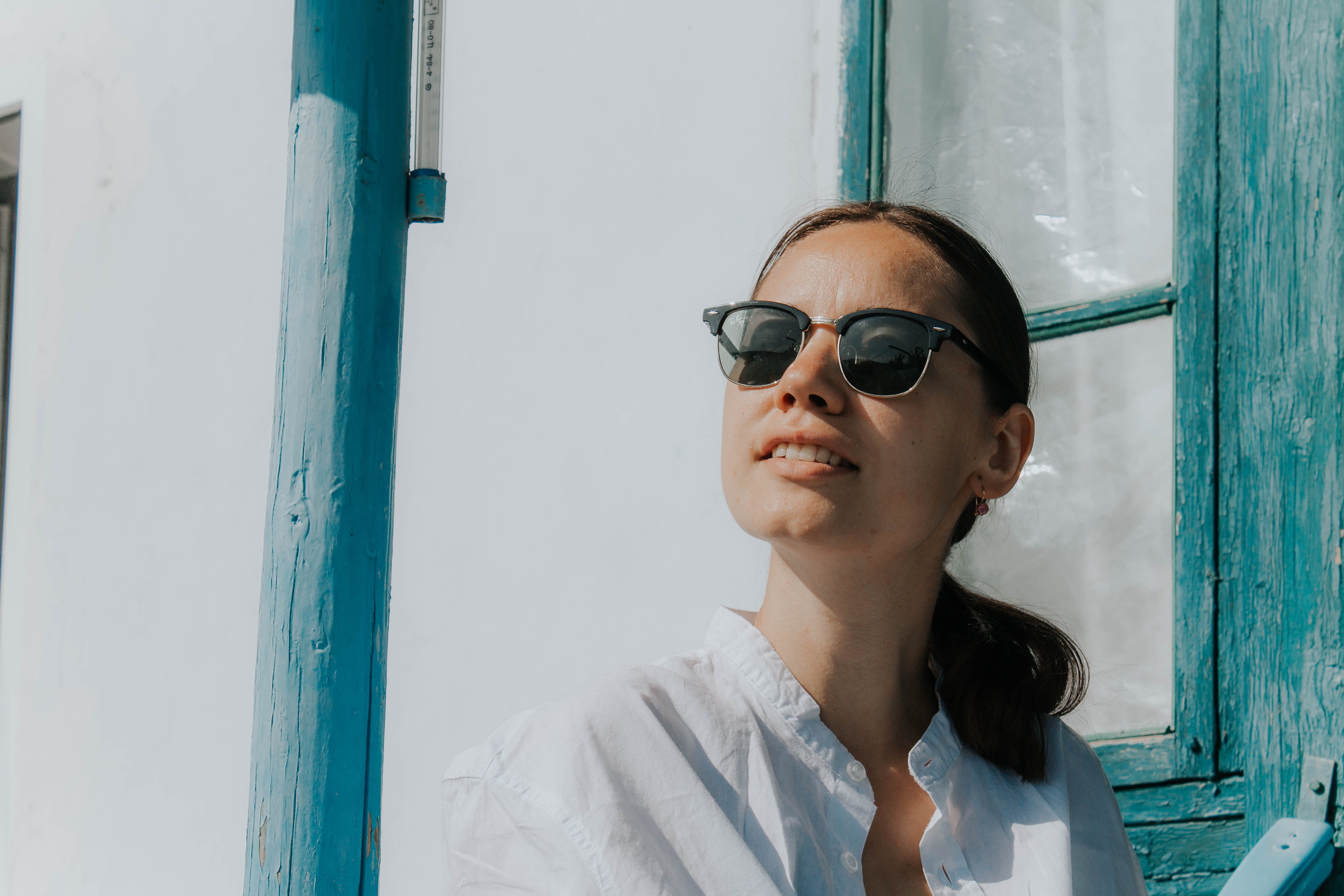 woman wearing black clubmaster sunglasses, one person, real people