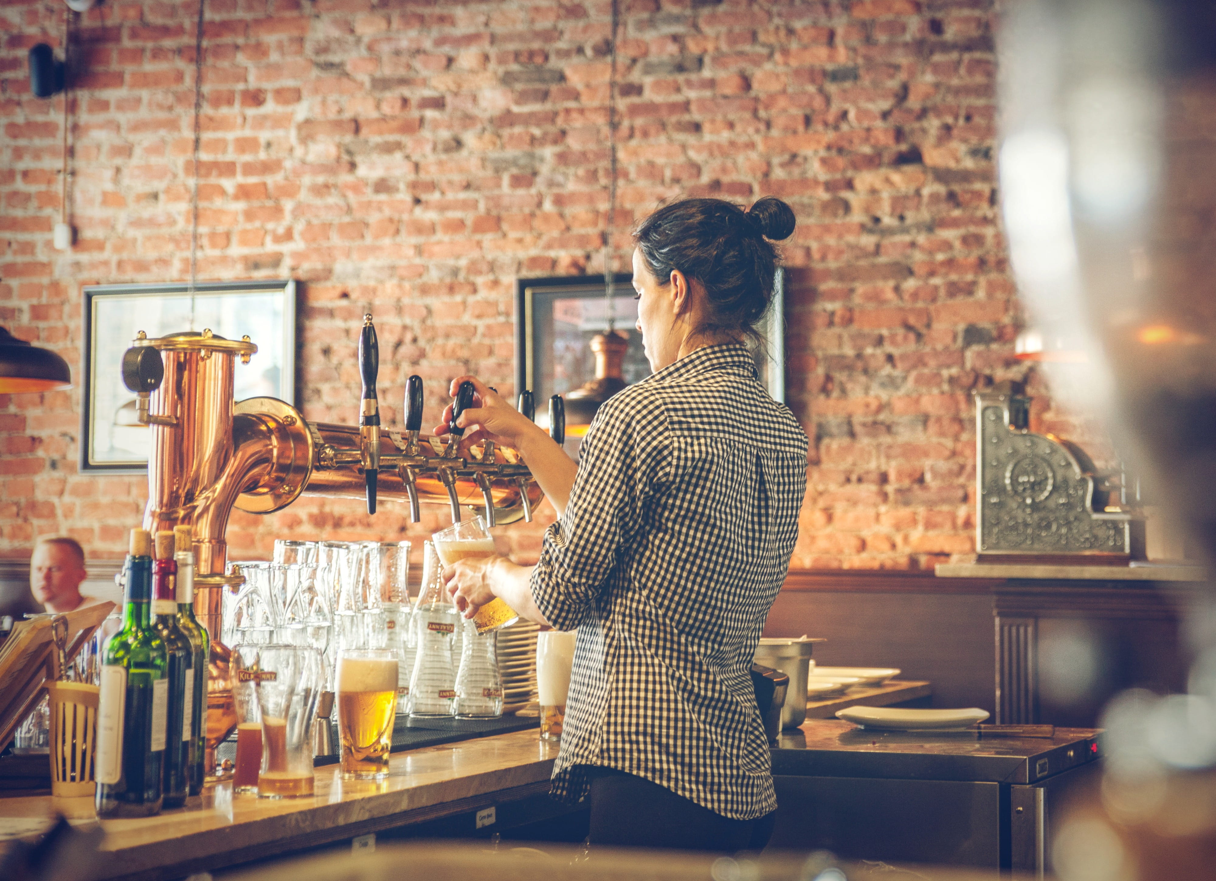 Photo of Bartender Pouring Draught Beer, alcohol, bar cafe, beer tap