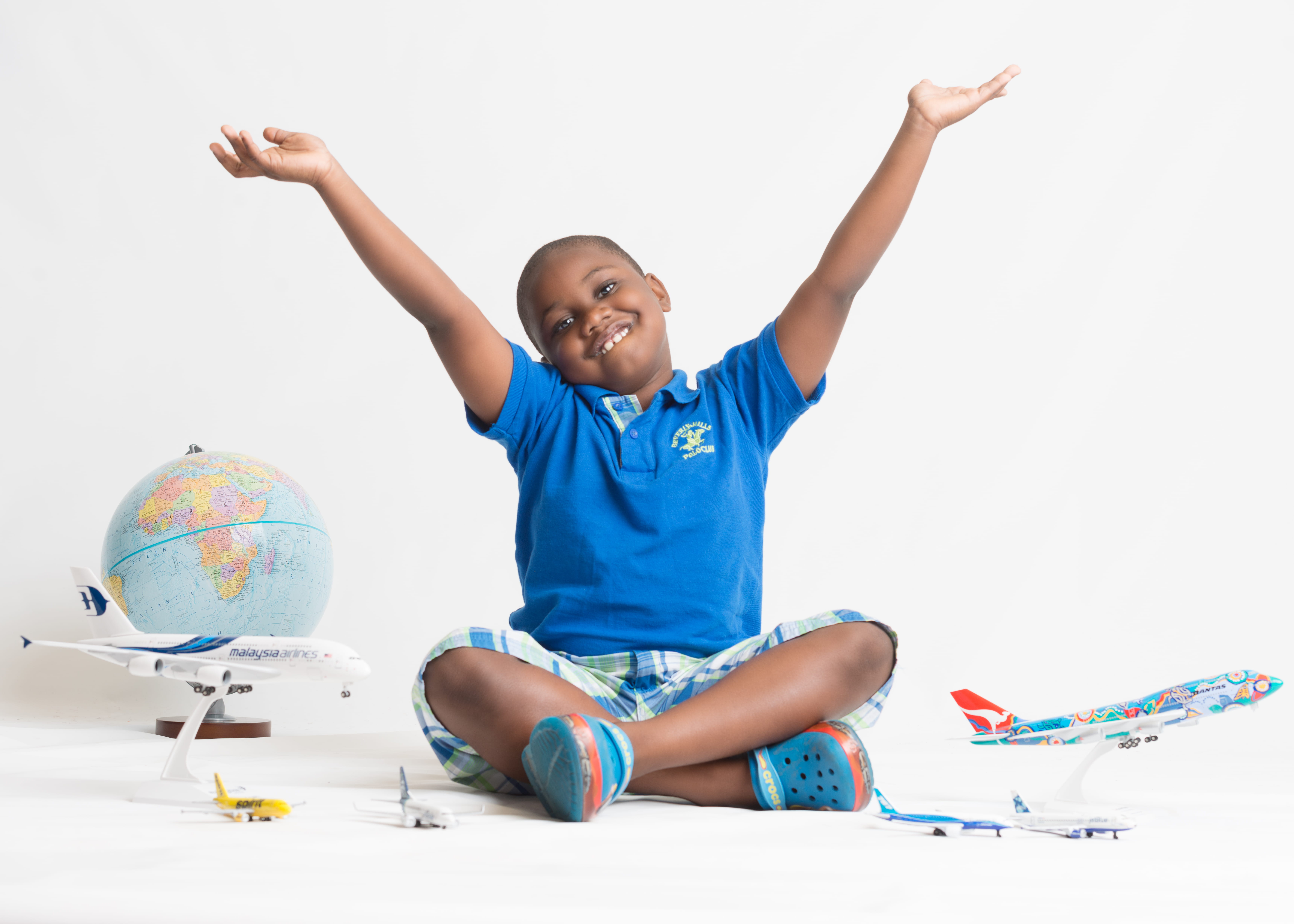 boy sitting while playing, smiling, happiness, limb, human arm