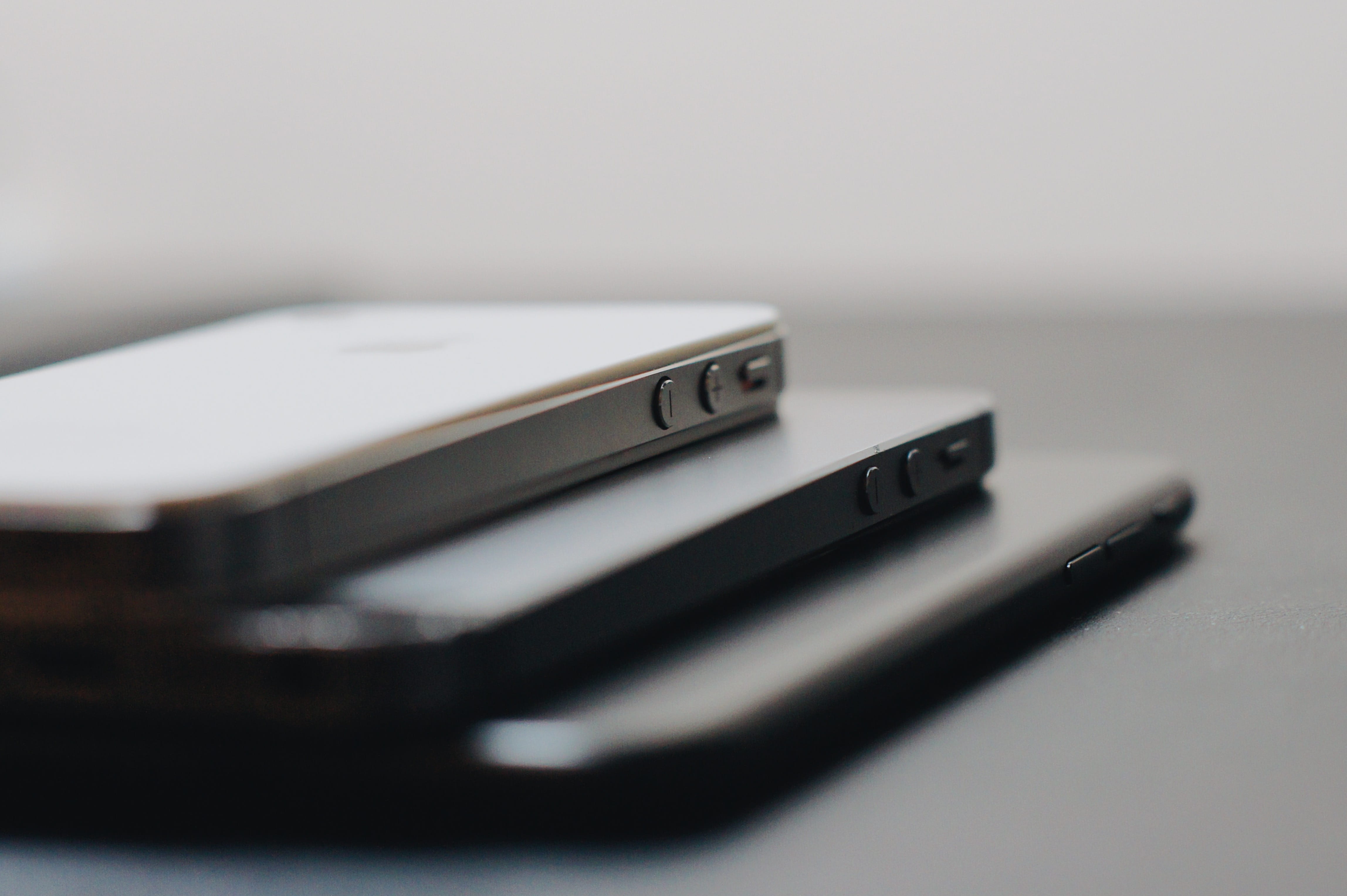 three iPhoneson black surface, poland, pabianice, grey, technology