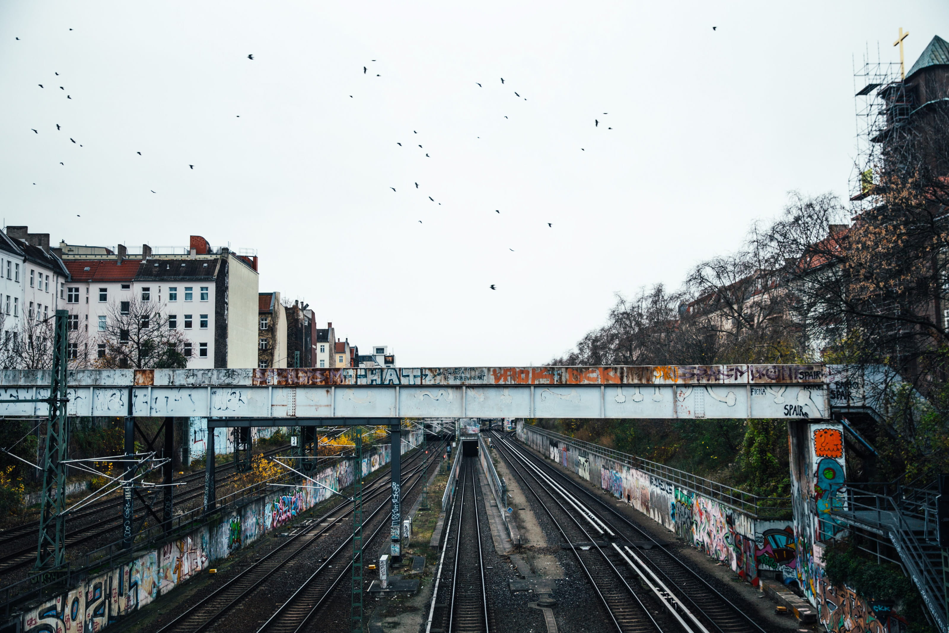 Graffiti walls near a train subway bridge and tracks, architecture