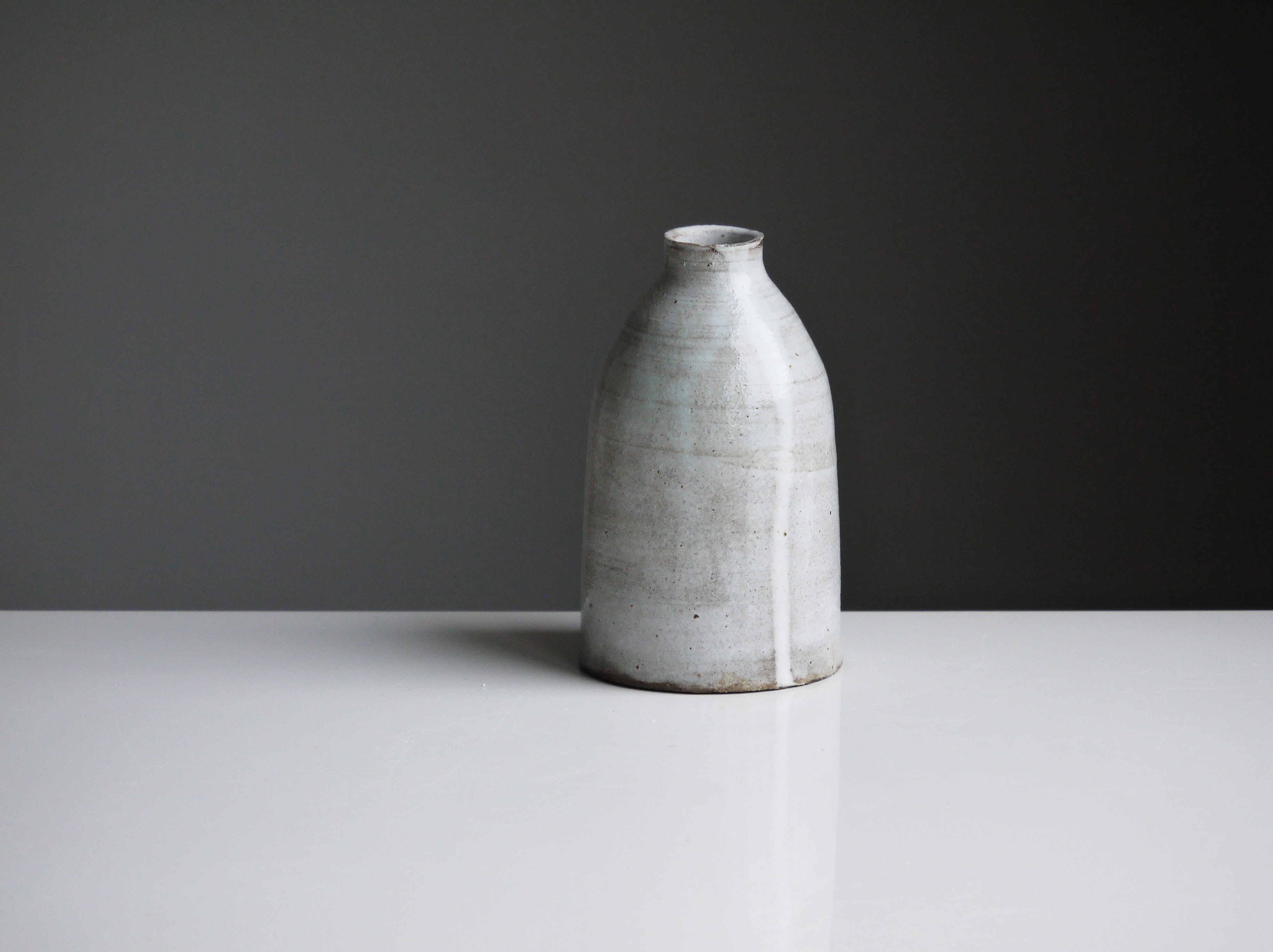 gray certamic pot, single object, indoors, studio shot, table