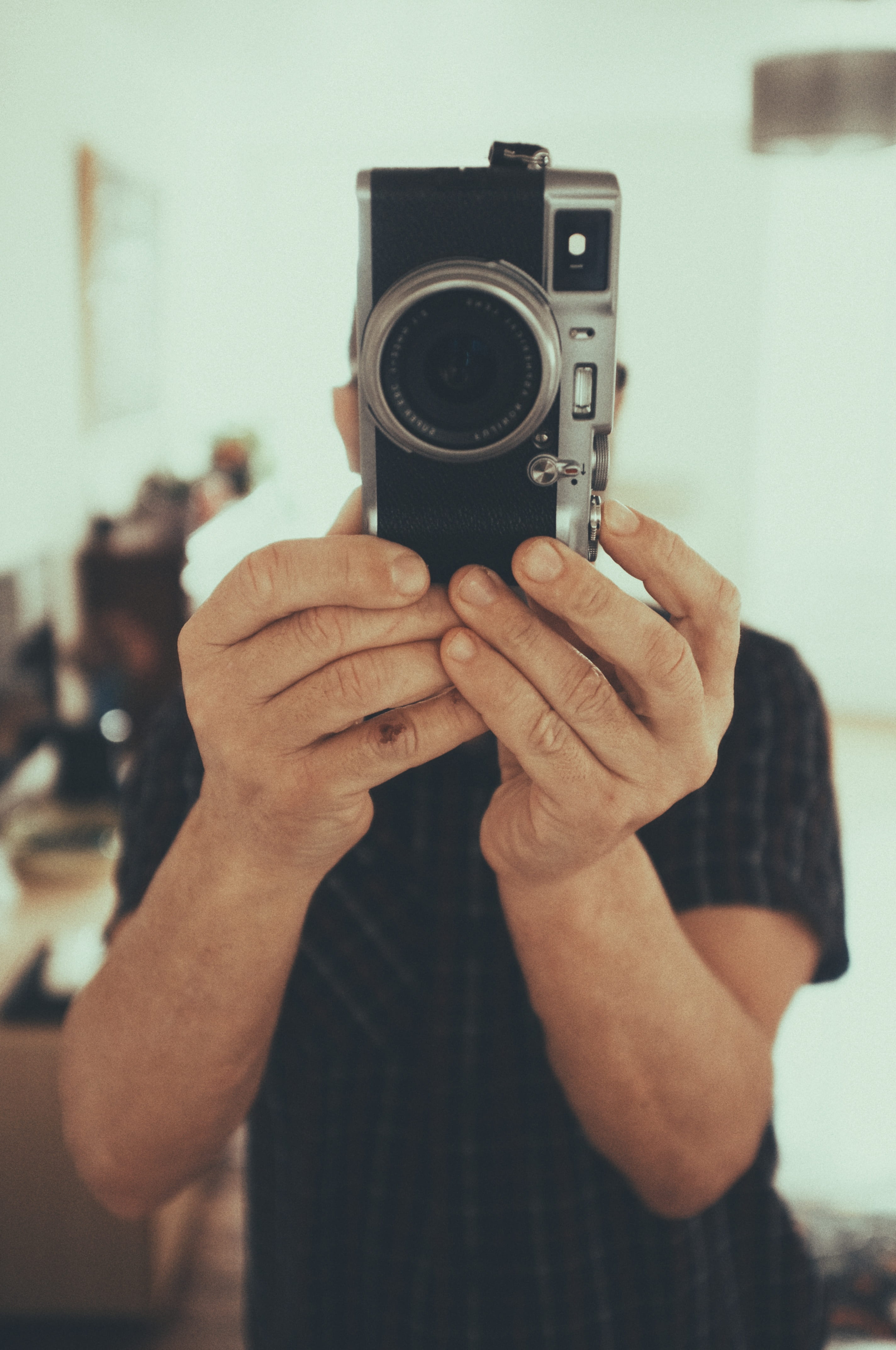 person using gray camera, human, electronics, finger, camera gear
