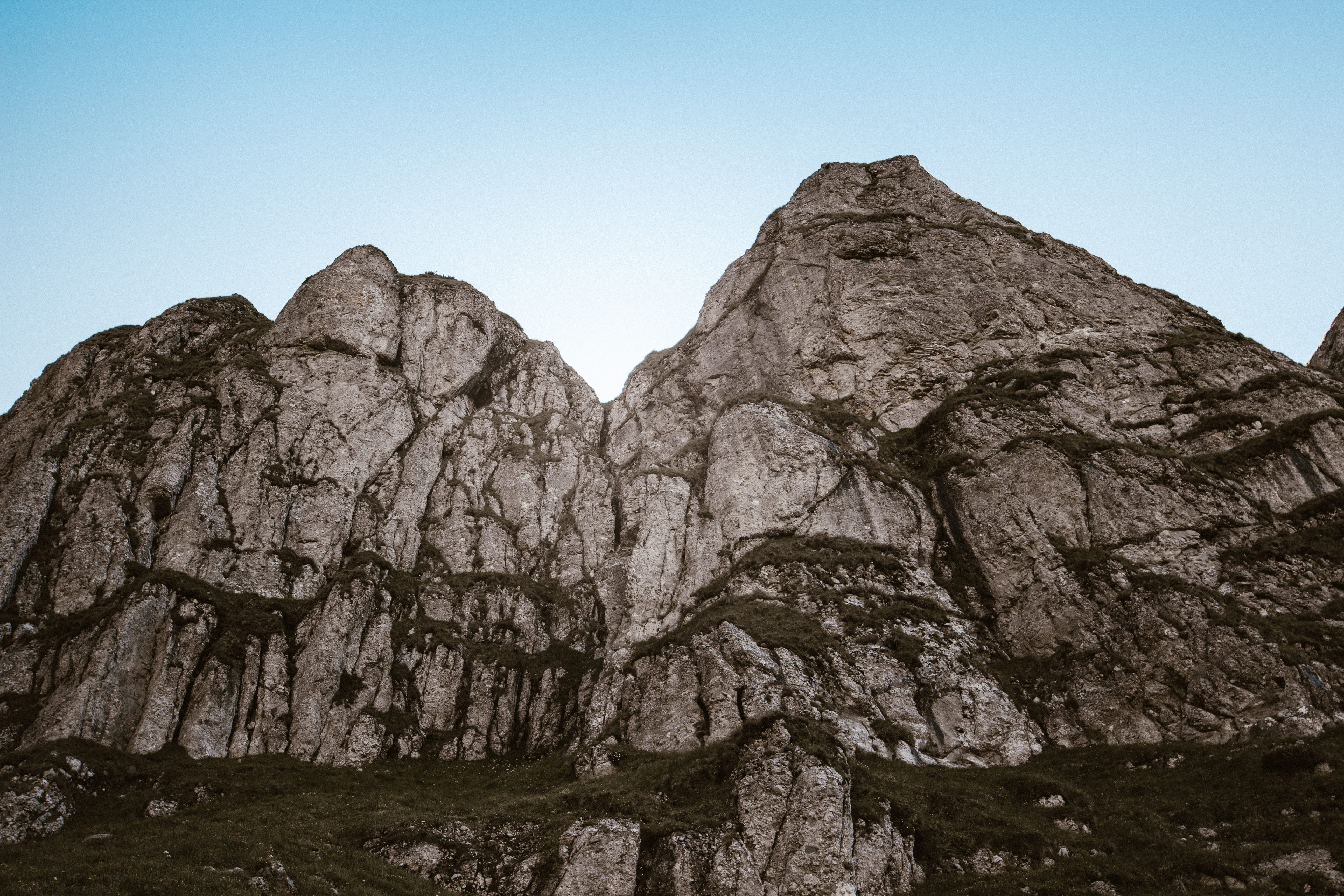 sky, rock, clear sky, rock - object, low angle view, solid