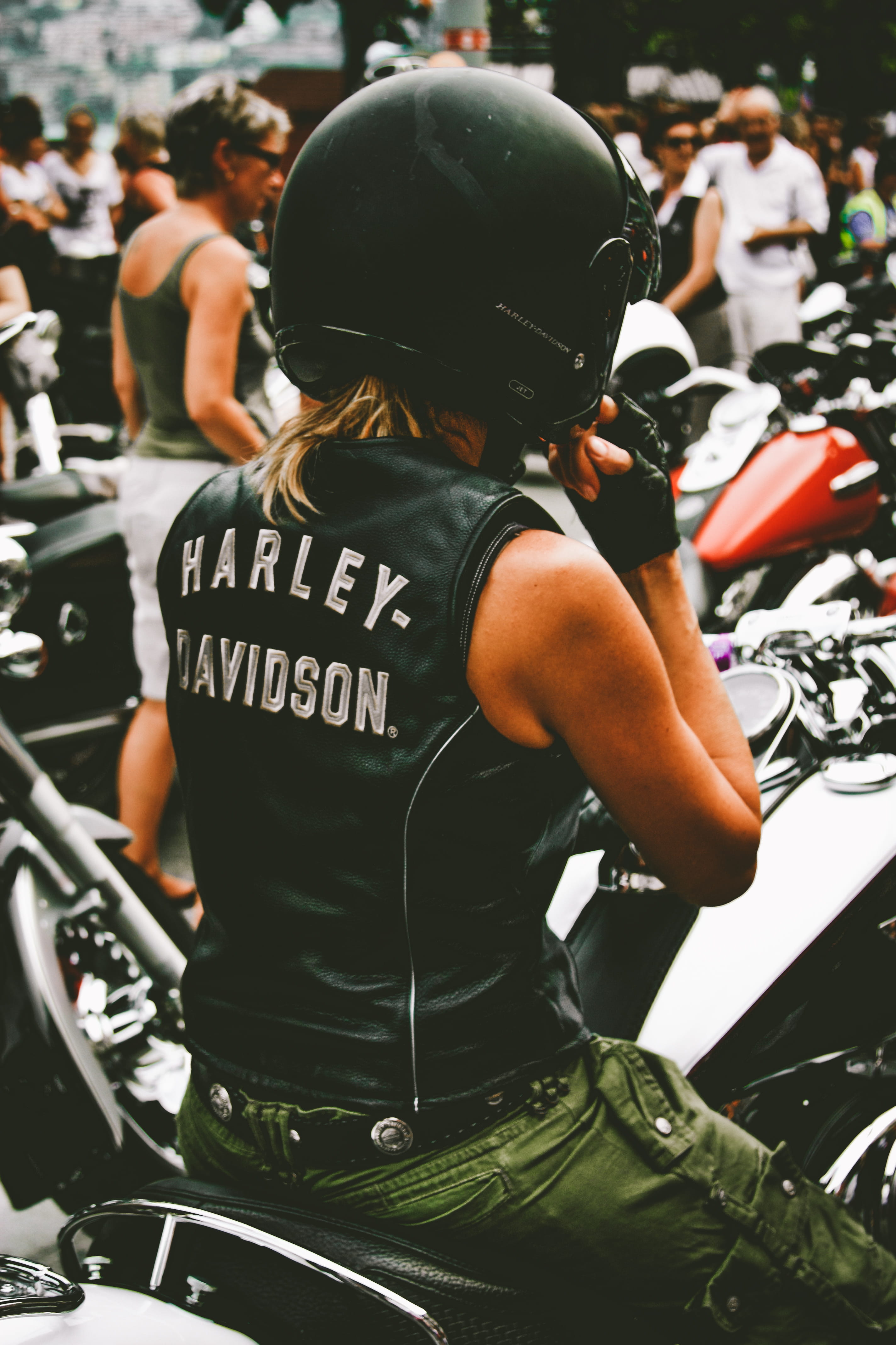 Photo of Person Riding Harley Davidson Motorcycle, back view