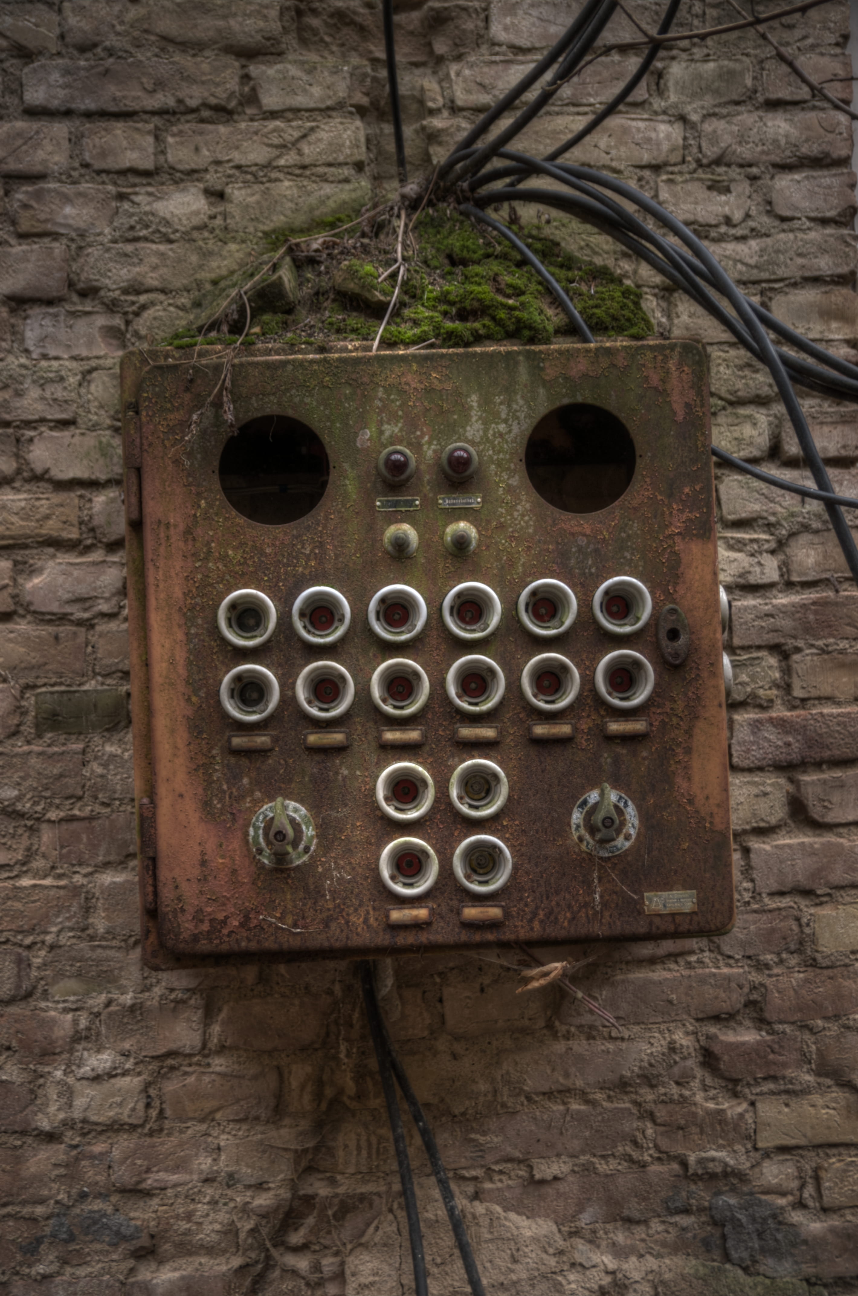 brown corded electronic device, brick, hole, rust, dungeon, lock