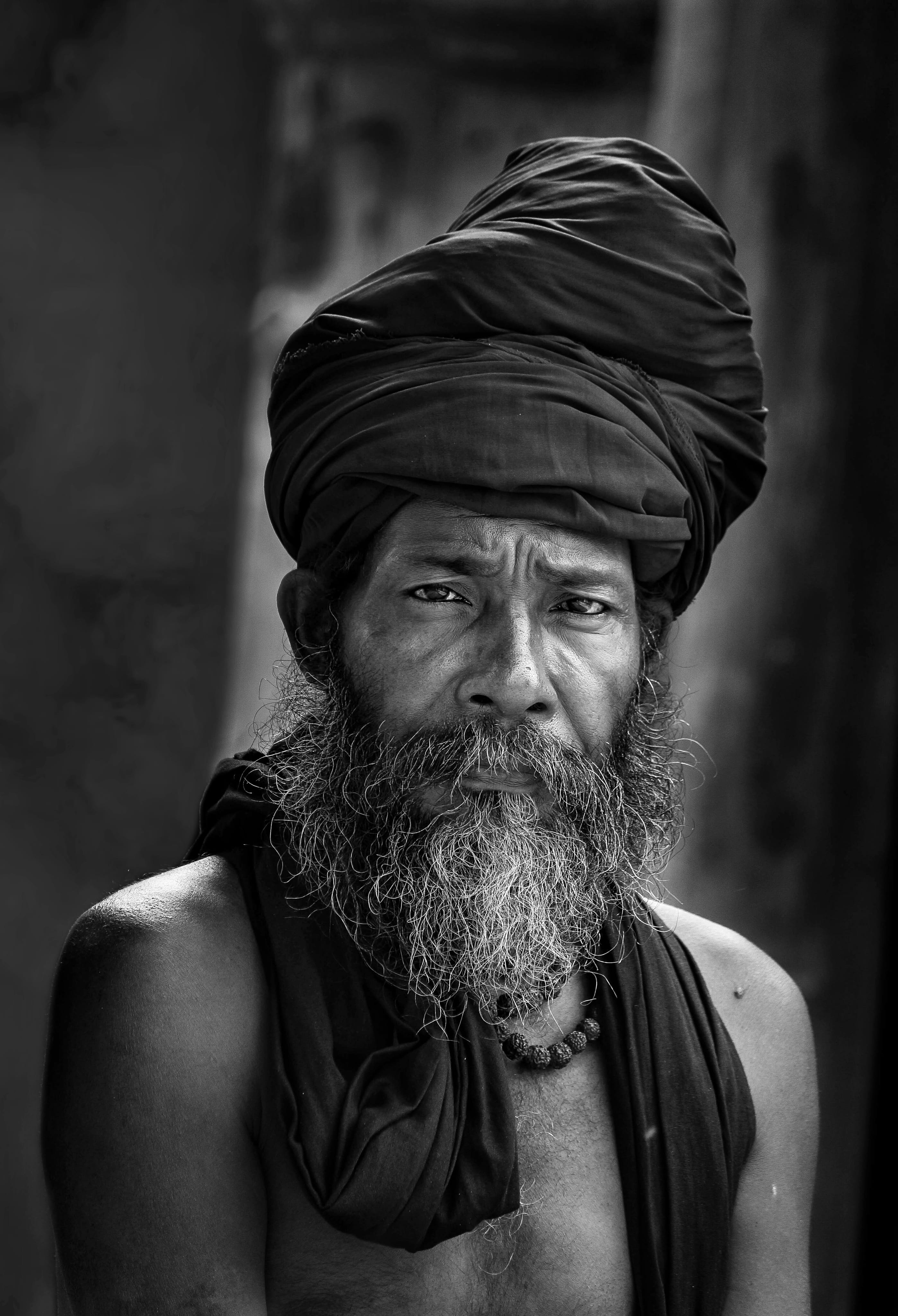 man wearing black turban hat, portrait, beard, indian man, elderly