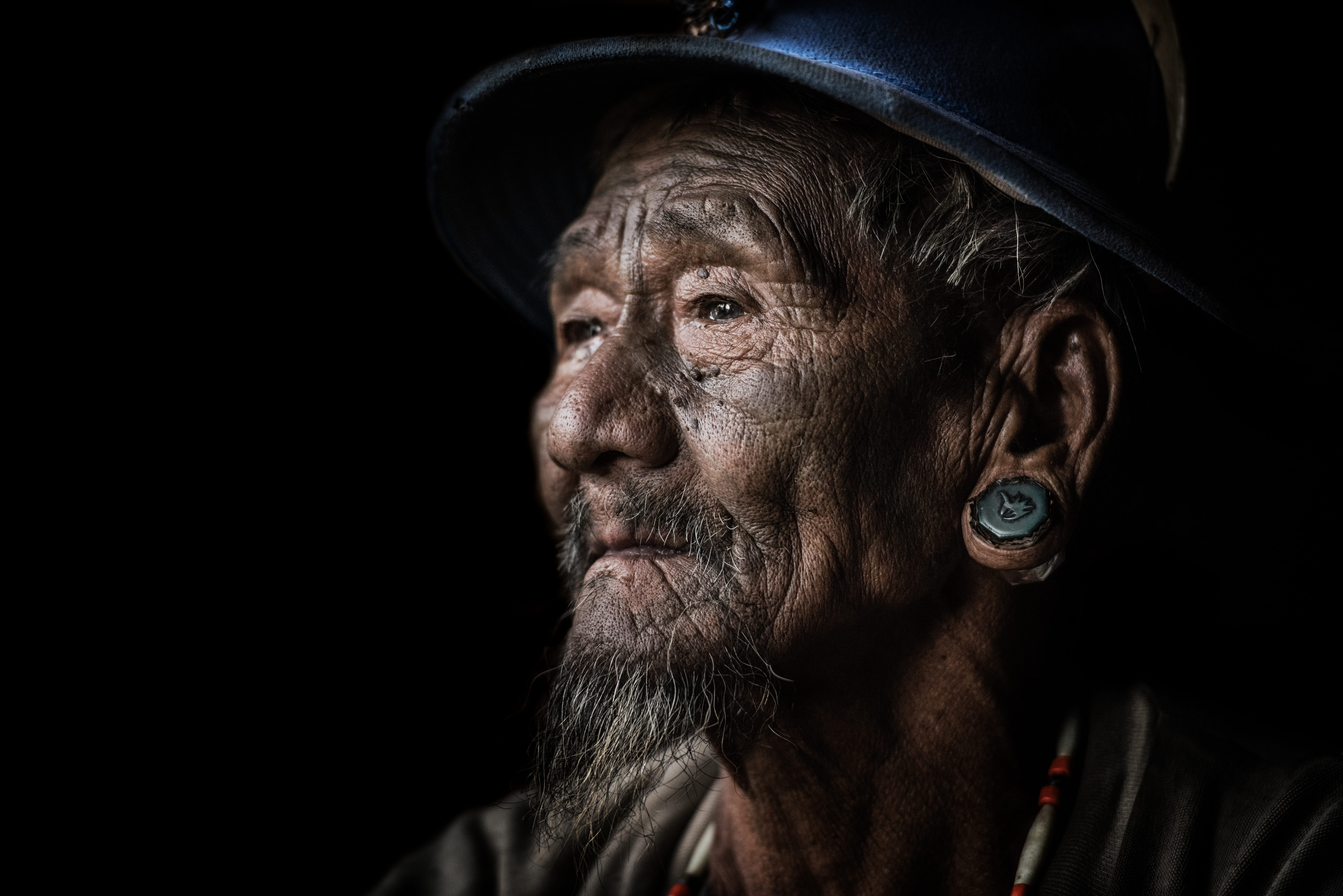 closeup photo of man, old man, facial hair, male, tattoo, ear plug