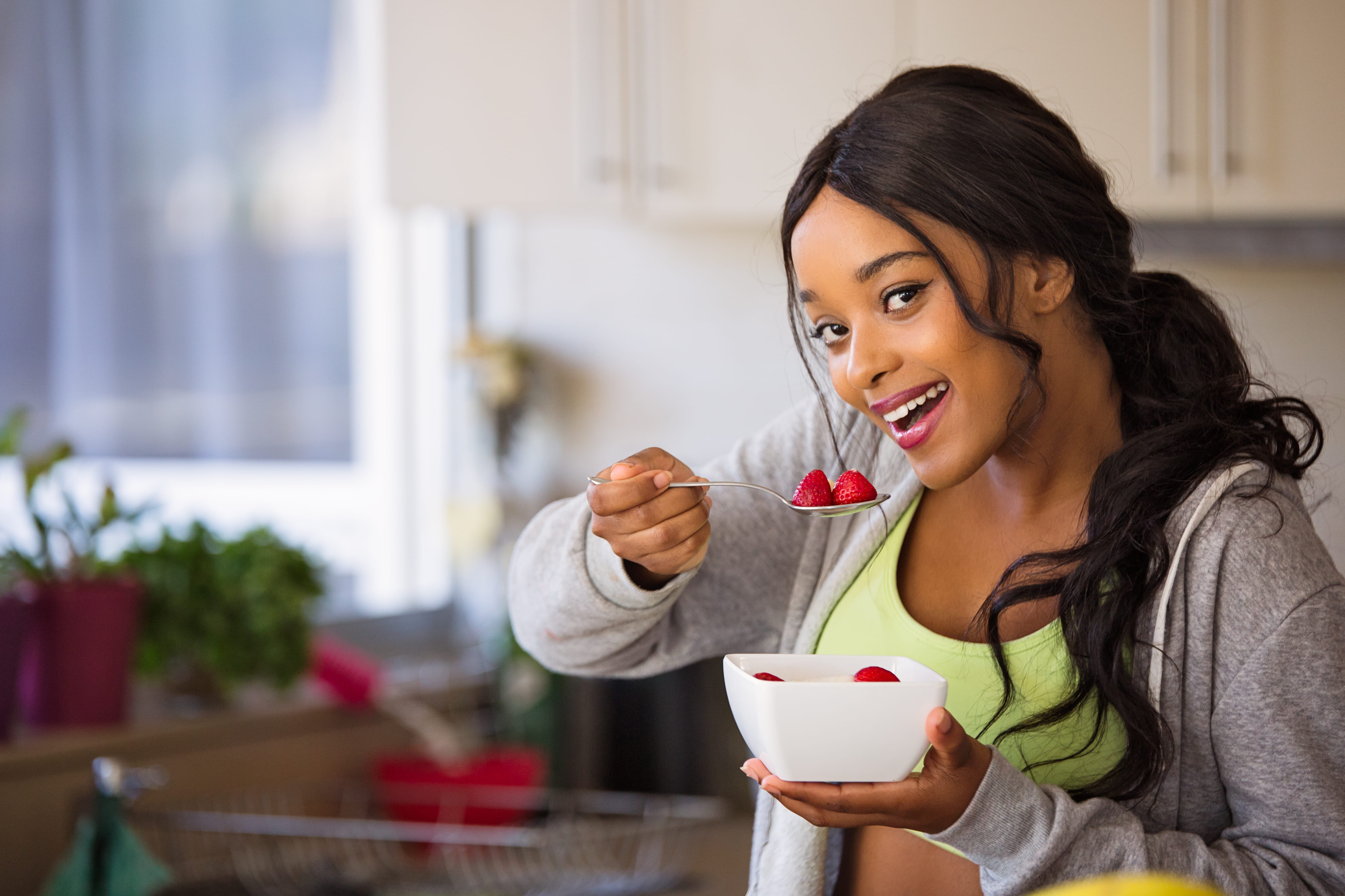 Woman About to Eat Strawberry, adult, bowl, brunette, eating healthy