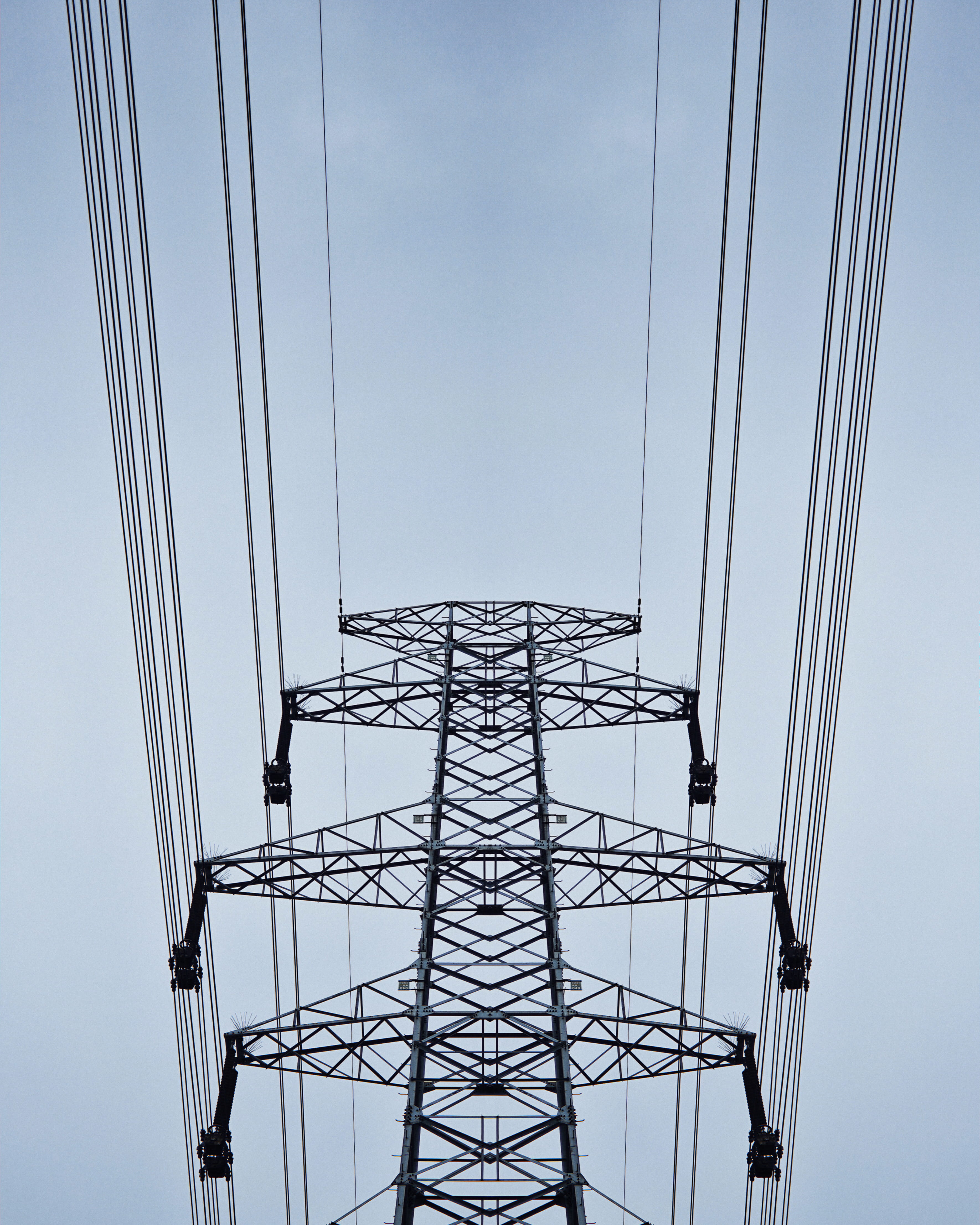 architectural photography of gray steel tower, cable, power lines