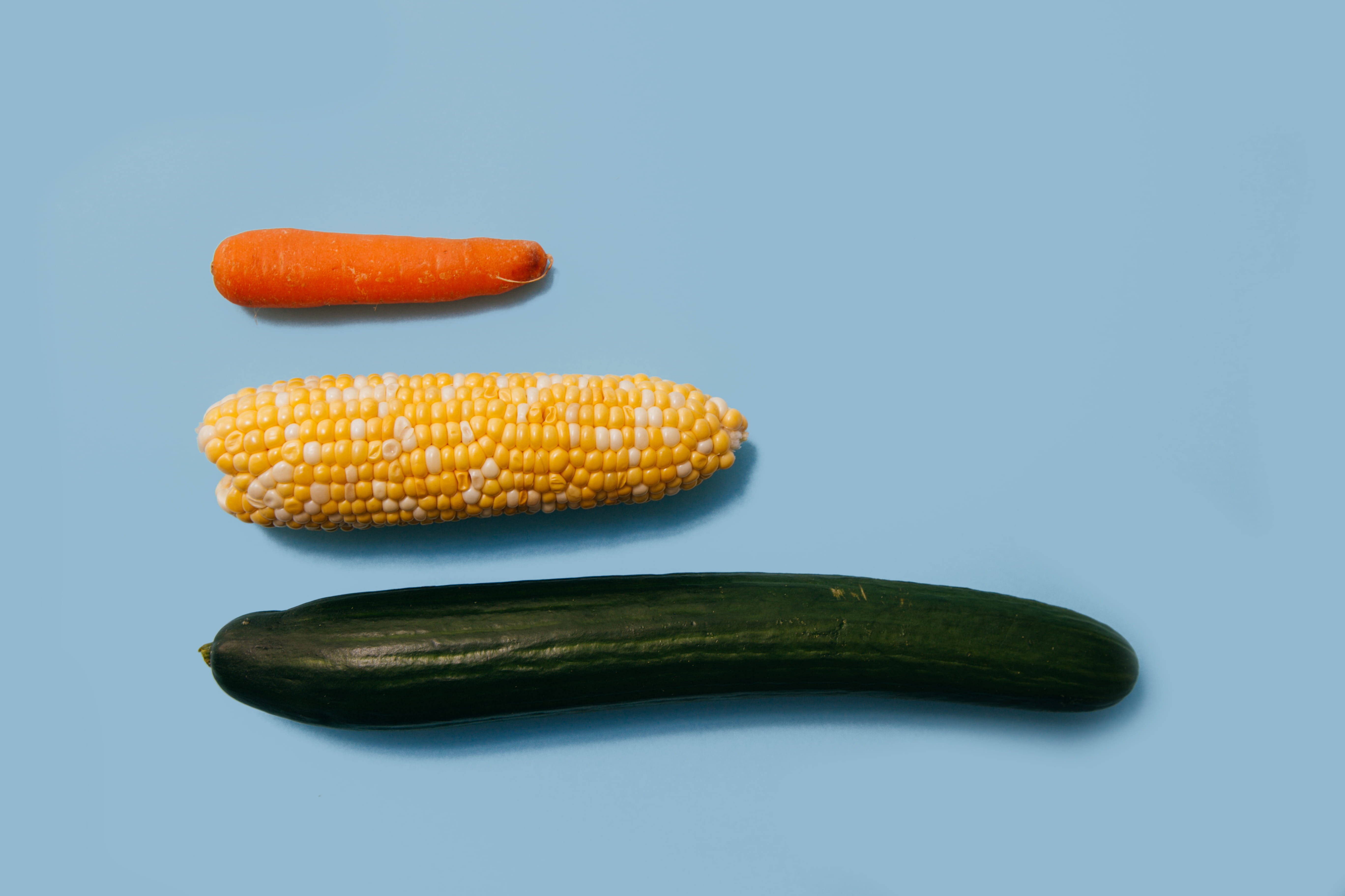three assorted vegetables, studio shot, colored background, wellbeing