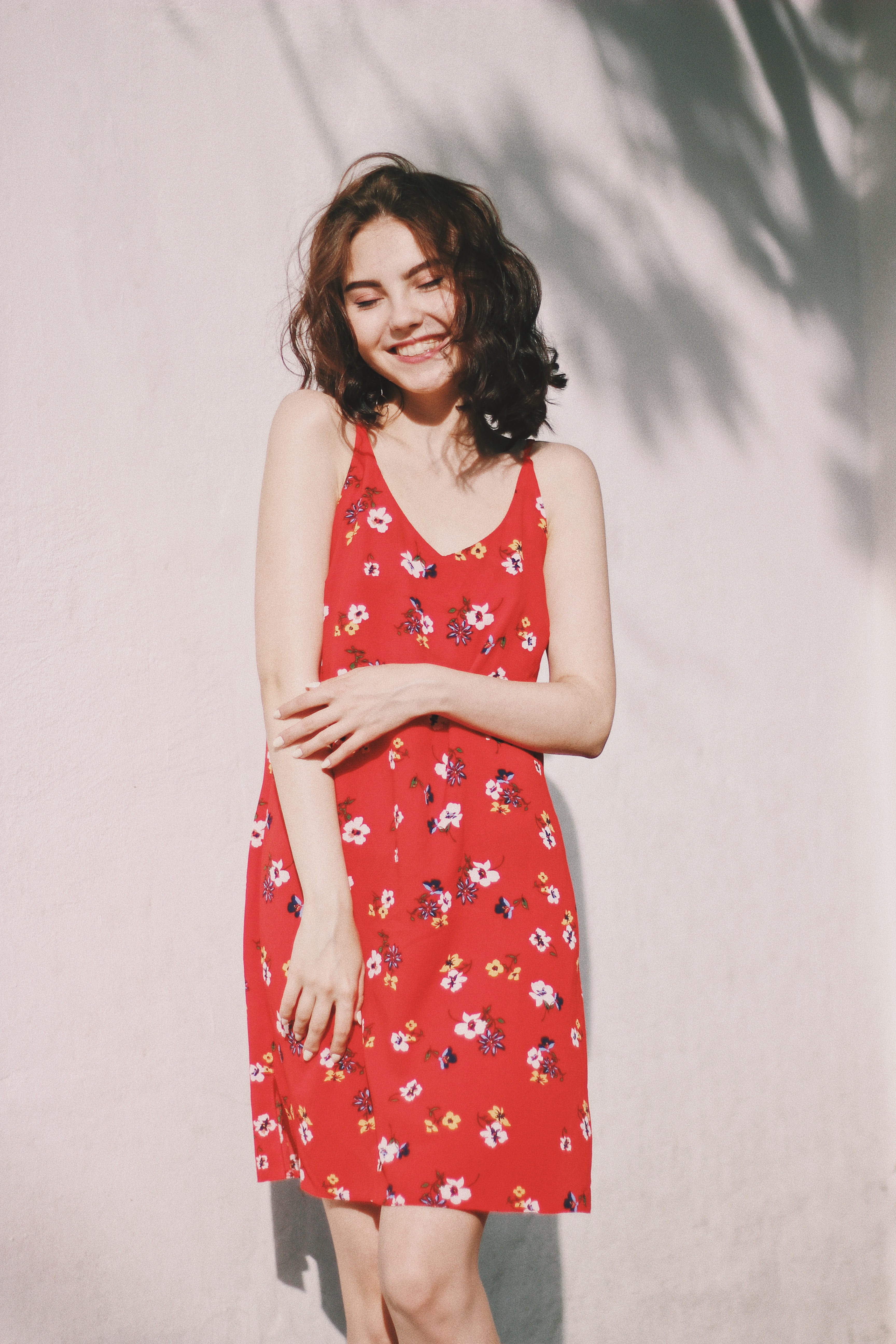 woman standing in front of white wall, dress, clothing, apparel