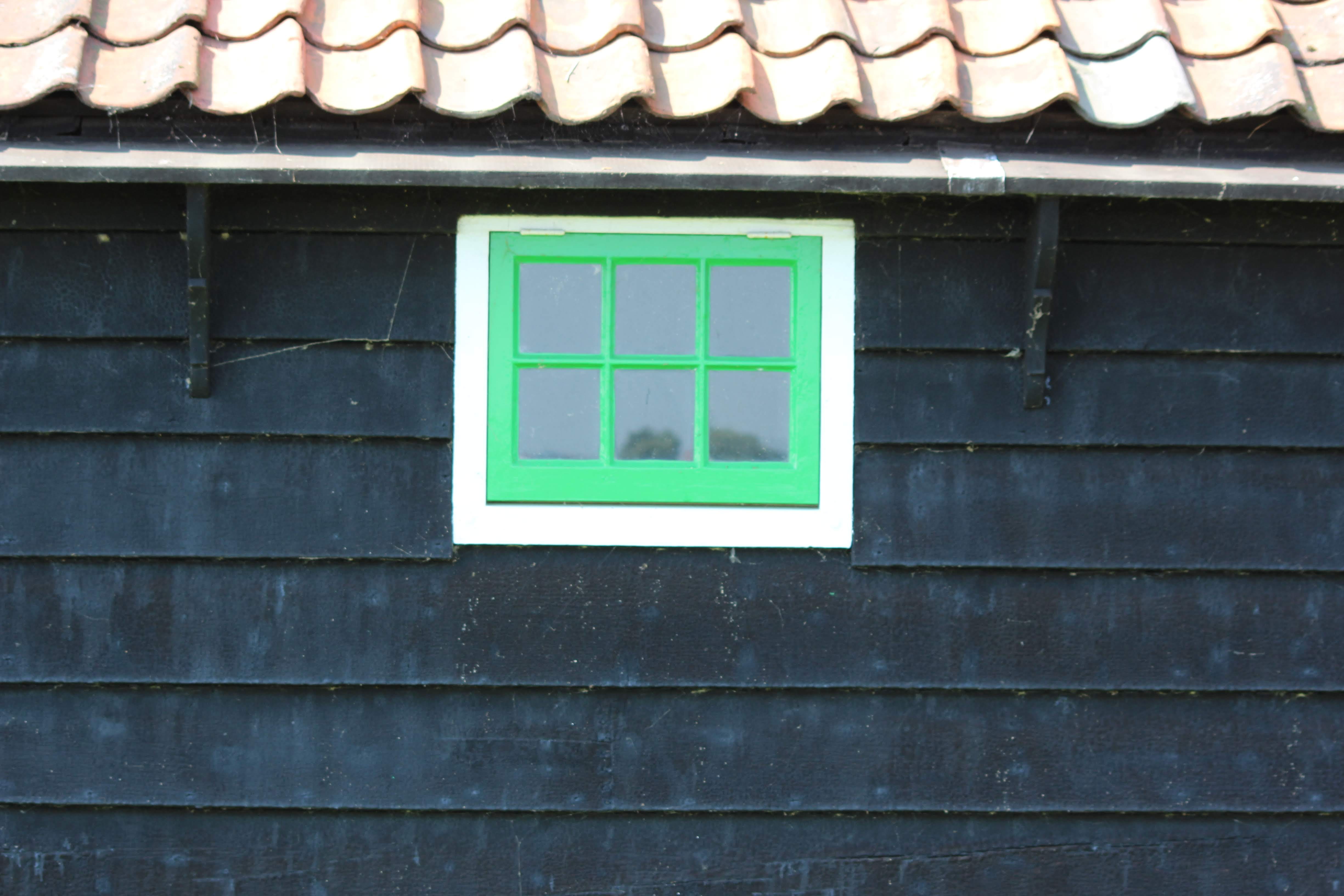 green window, black siding, windmill, architecture, built structure