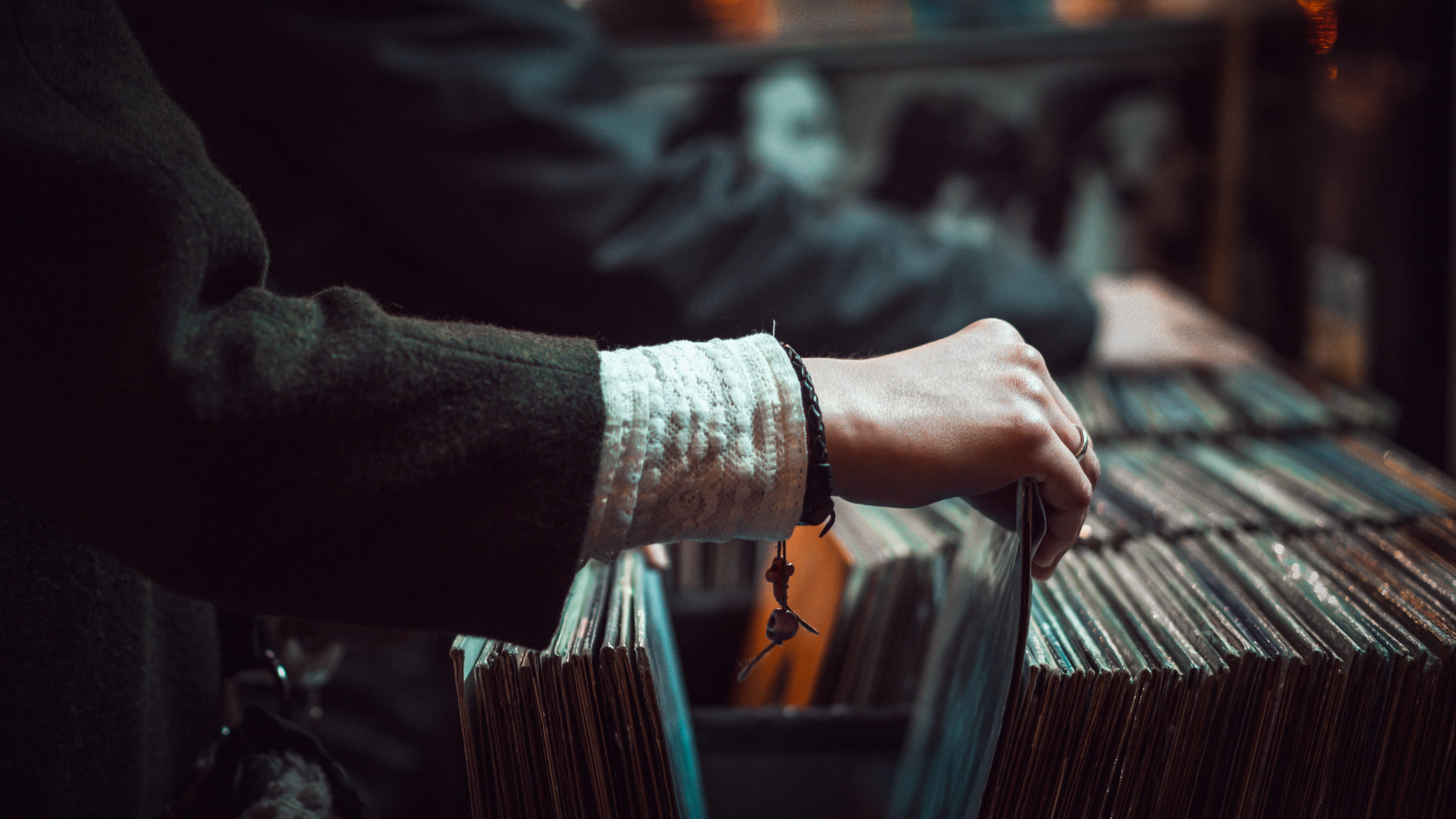 person picking up the music record, hand, vintage, vinyl, lady