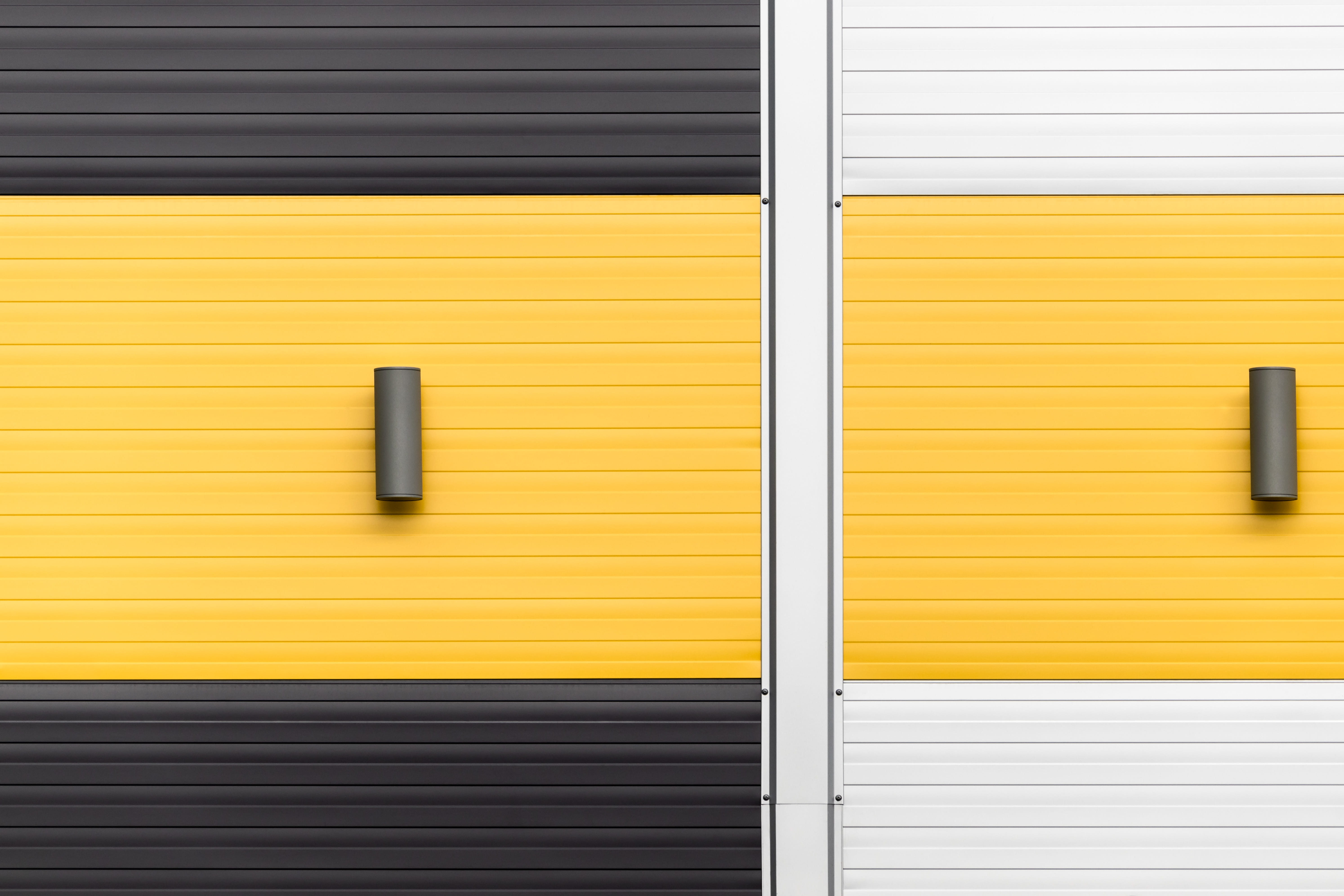 yellow, white, and black panels, wall, building, light, stripe