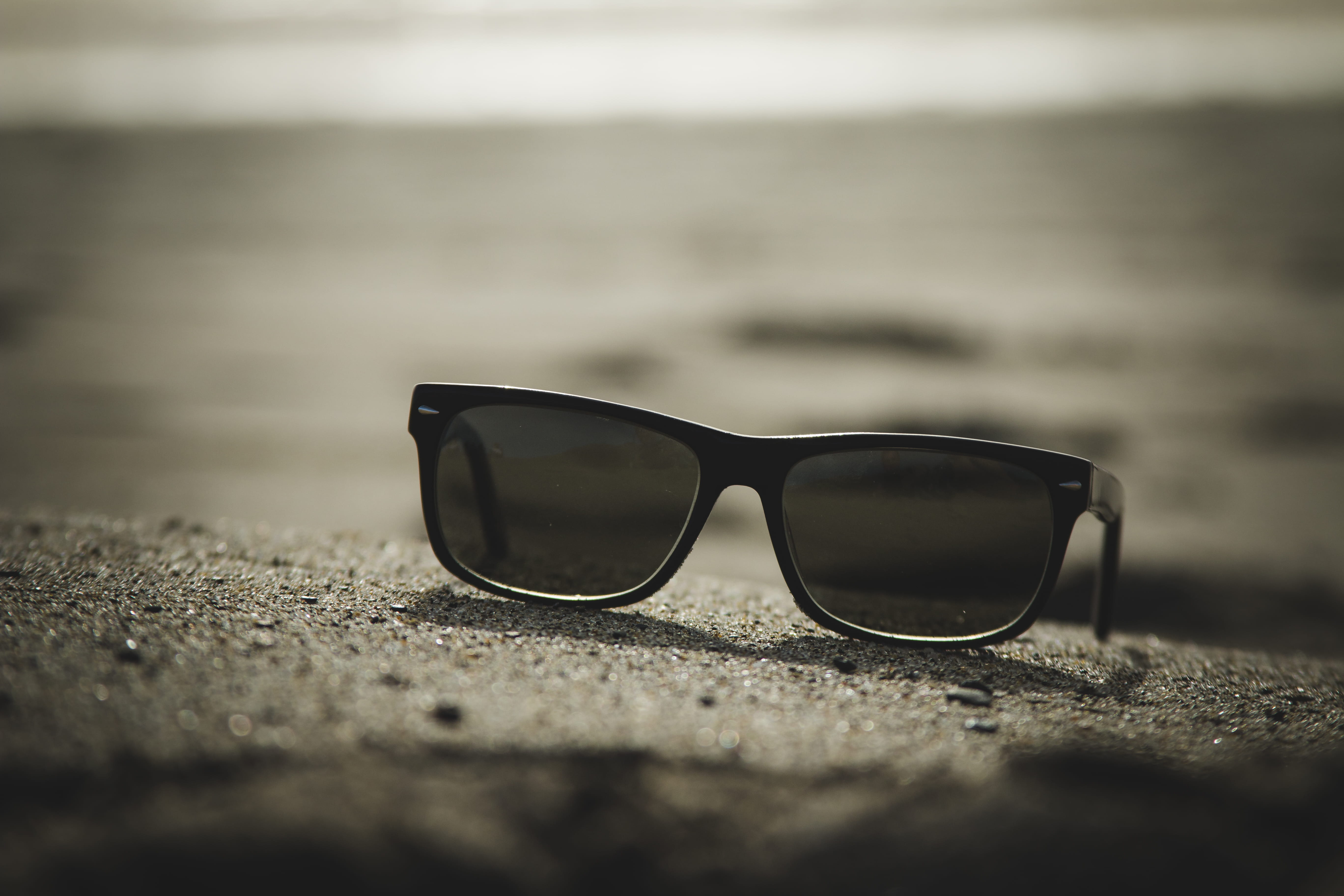 sunglasses with black frames, selective focus, eyeglasses, close-up